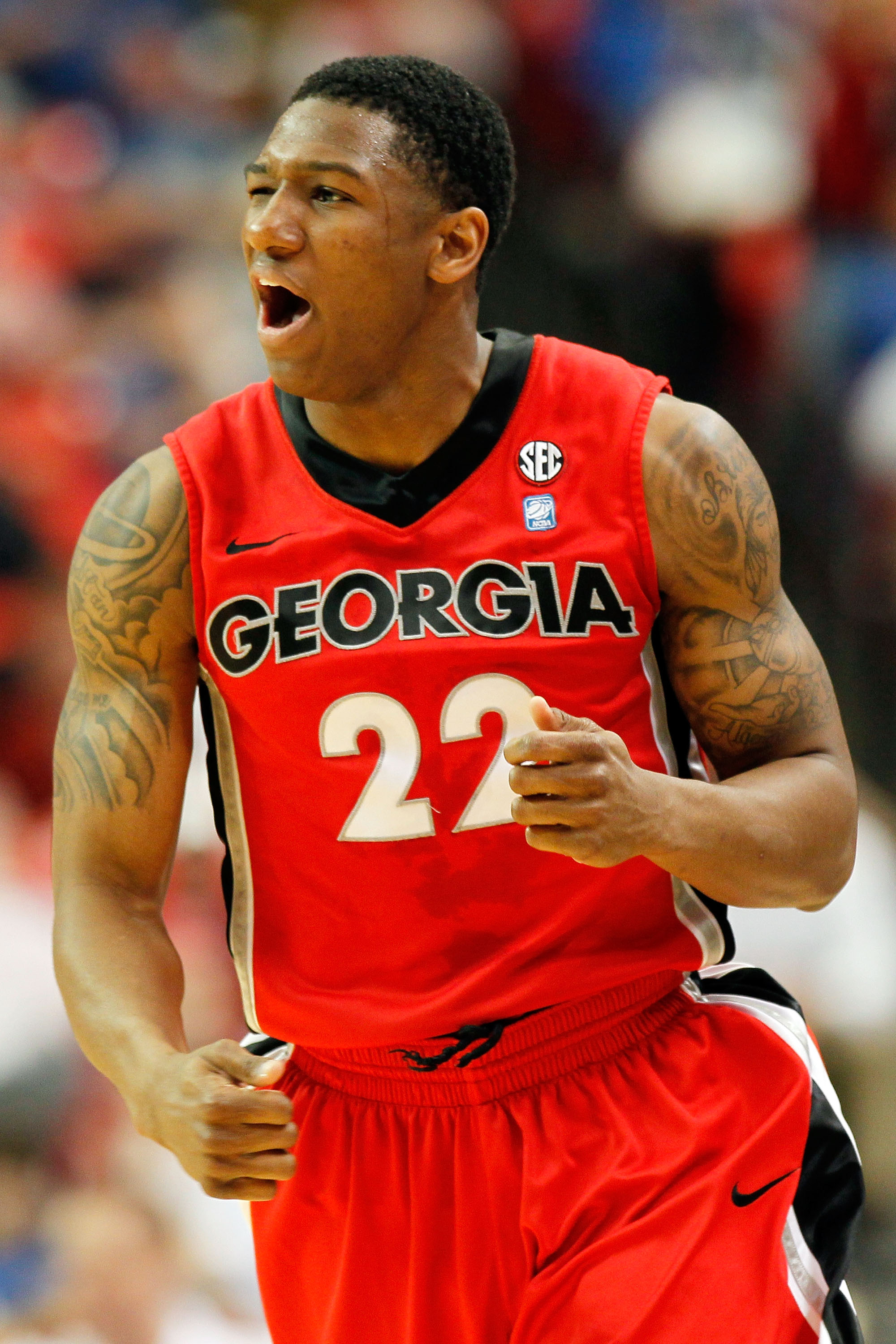 ATLANTA, GA - MARCH 11: Gerald Robinson #22 of the Georgia Bulldogs celebrates after hitting a 3 point shot against the Alabama Crimson Tide during the quarterfinals of the SEC Men's Basketball Tournament at Georgia Dome on March 11, 2011 in Atlanta, Geo