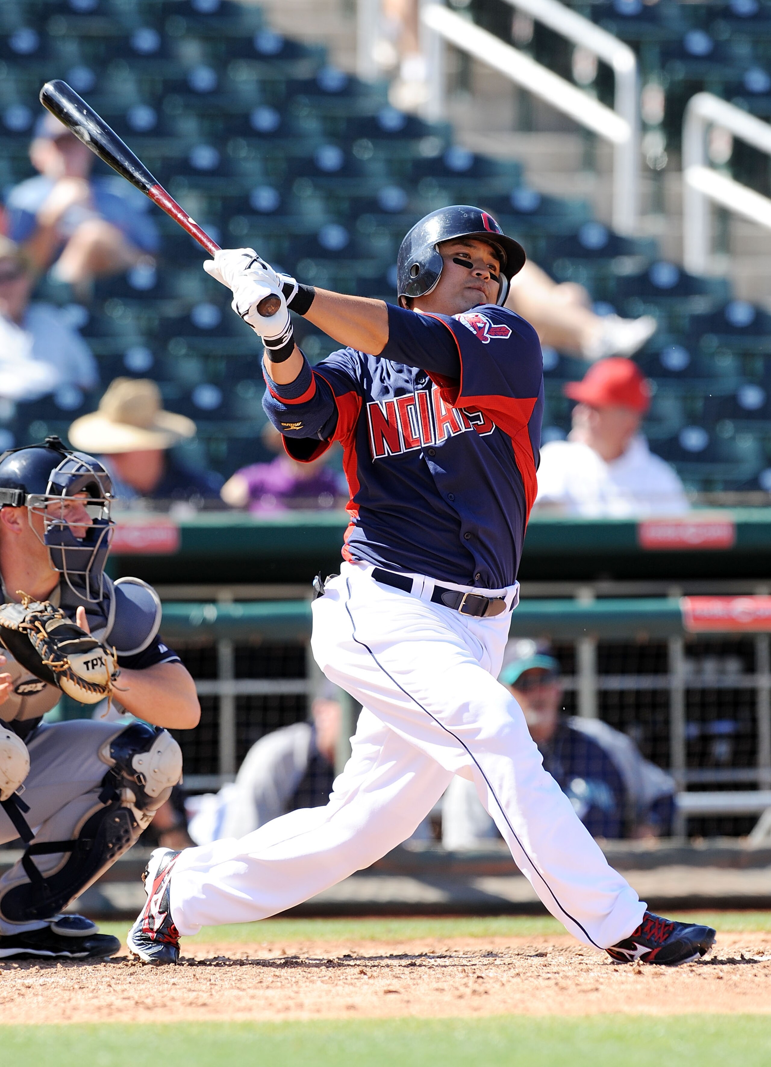 GOODYEAR, AZ - MARCH 11:  Shin-Soo Choo #17 of the Cleveland Indians follows through on a swing against the Seattle Mariners at Goodyear Ballpark on March 11, 2011 in Goodyear, Arizona.  (Photo by Norm Hall/Getty Images)