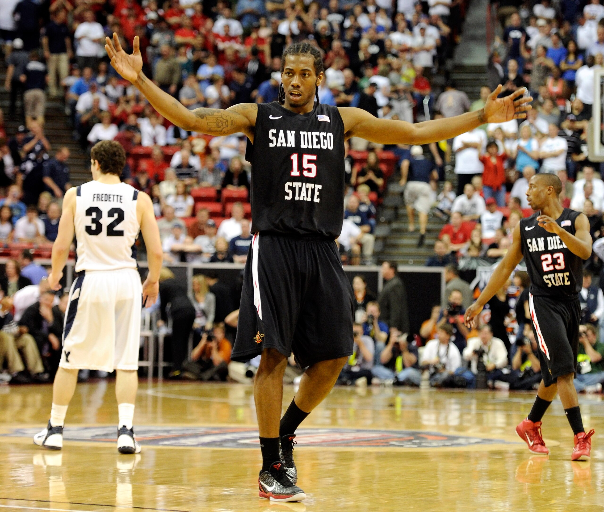 LAS VEGAS, NV - MARCH 12:  Kawhi Leonard #15 of the San Diego State Aztecs raises his arms in the last few seconds of the team's 72-54 victory over the Brigham Young University Cougars in the championship game of the Conoco Mountain West Conference Basket