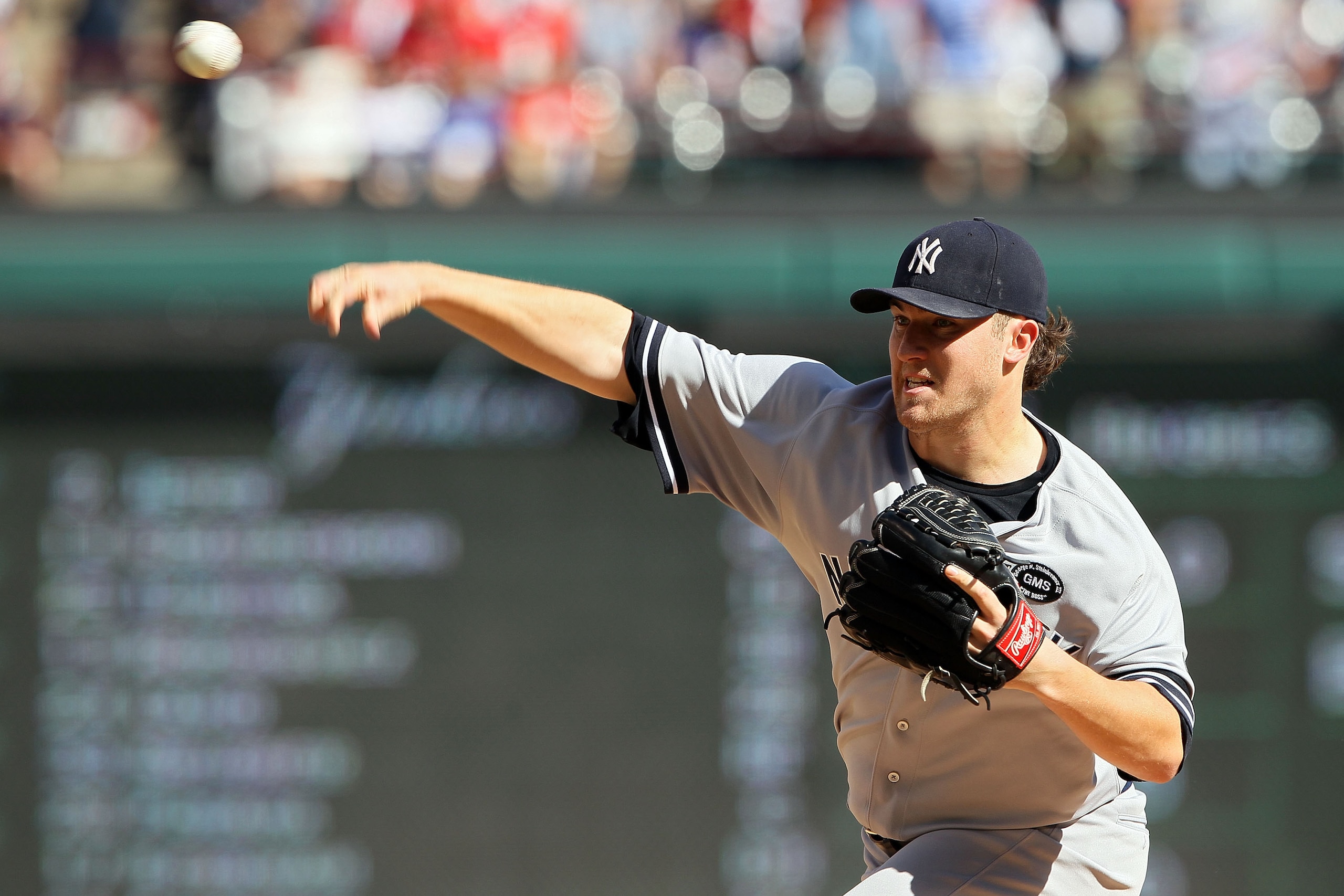 ARLINGTON, TX - OCTOBER 16:  Phil Hughes #65 of the New York Yankees pitches against the Texas Rangers in Game Two of the ALCS during the 2010 MLB Playoffs at Rangers Ballpark in Arlington on October 16, 2010 in Arlington, Texas.  (Photo by Elsa/Getty Ima