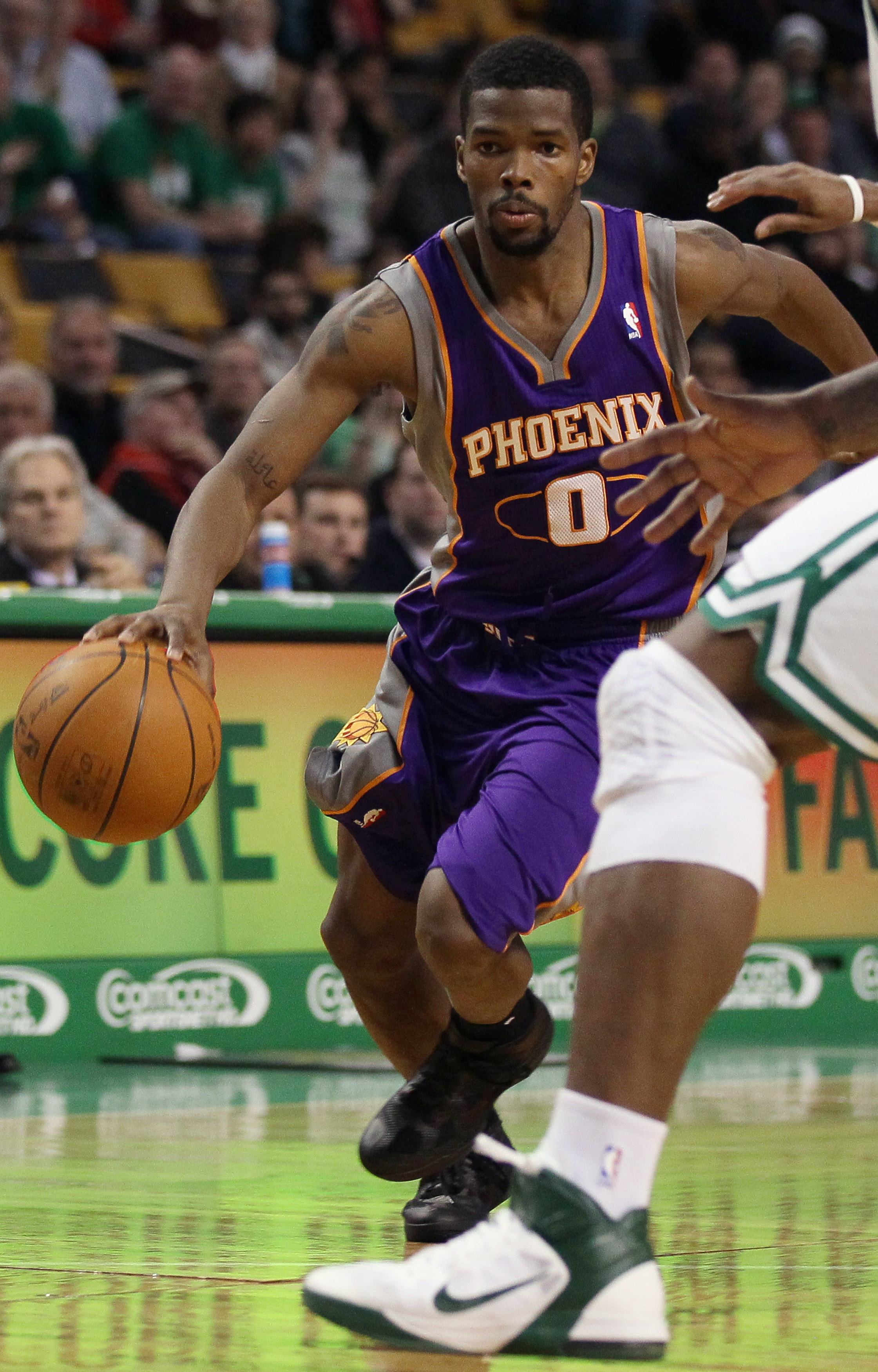 BOSTON, MA - MARCH 02:  Aaron Brooks #0 of the Phoenix Suns heads for the net in the second half against the Boston Celtics on March 2, 2011 at the TD Garden in Boston, Massachusetts.  The Celtics defeated the Suns 115-103. NOTE TO USER: User expressly ac