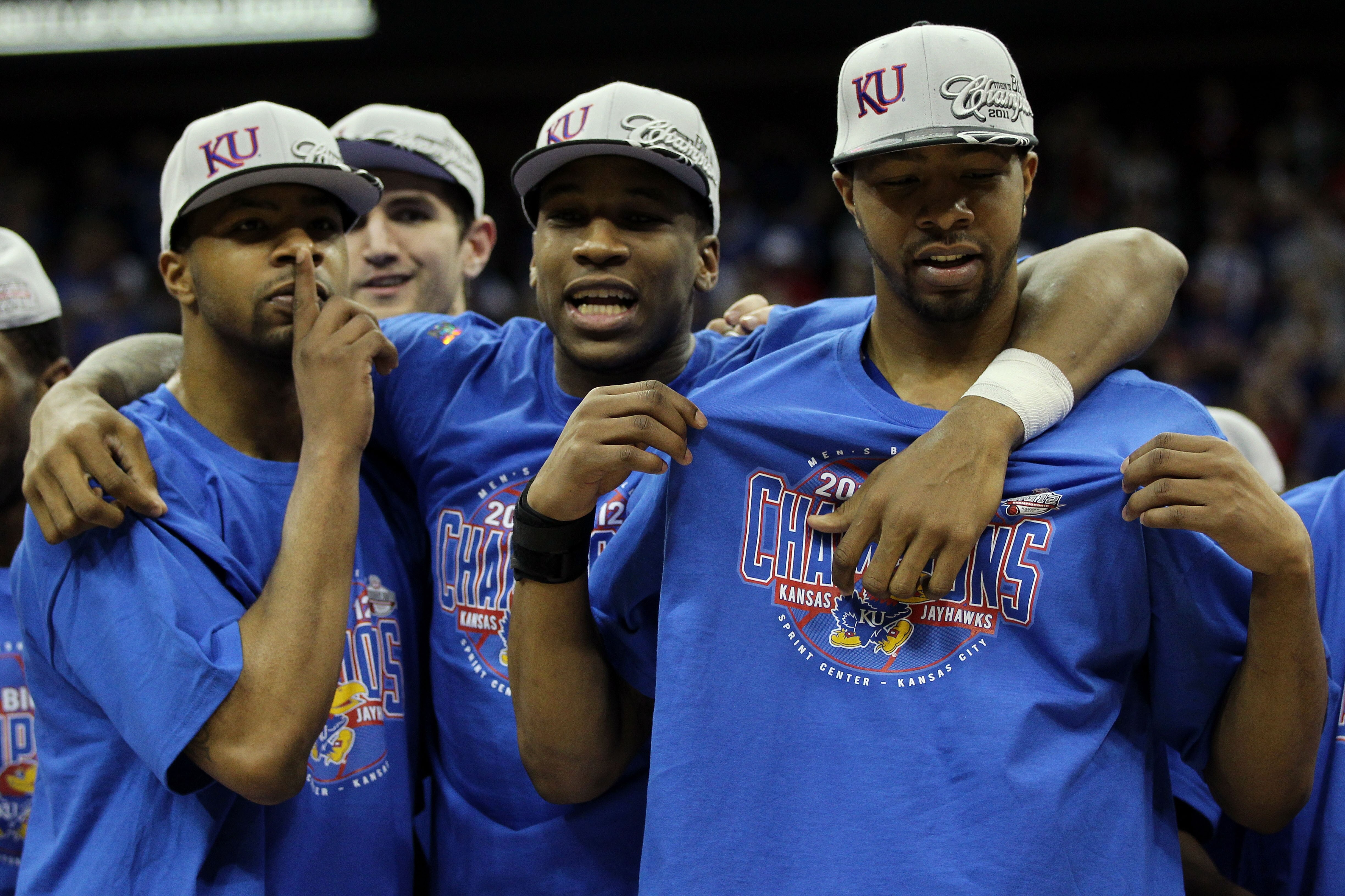 KANSAS CITY, MO - MARCH 12:  (L-R) Marcus Morris #22, Thomas Robinson #0 and Markieff Morris #21 of the Kansas Jayhawks celebrate after defeating the Texas Longhorns 85-73 to win the 2011 Phillips 66 Big 12 Men's Basketball Tournament championship game at
