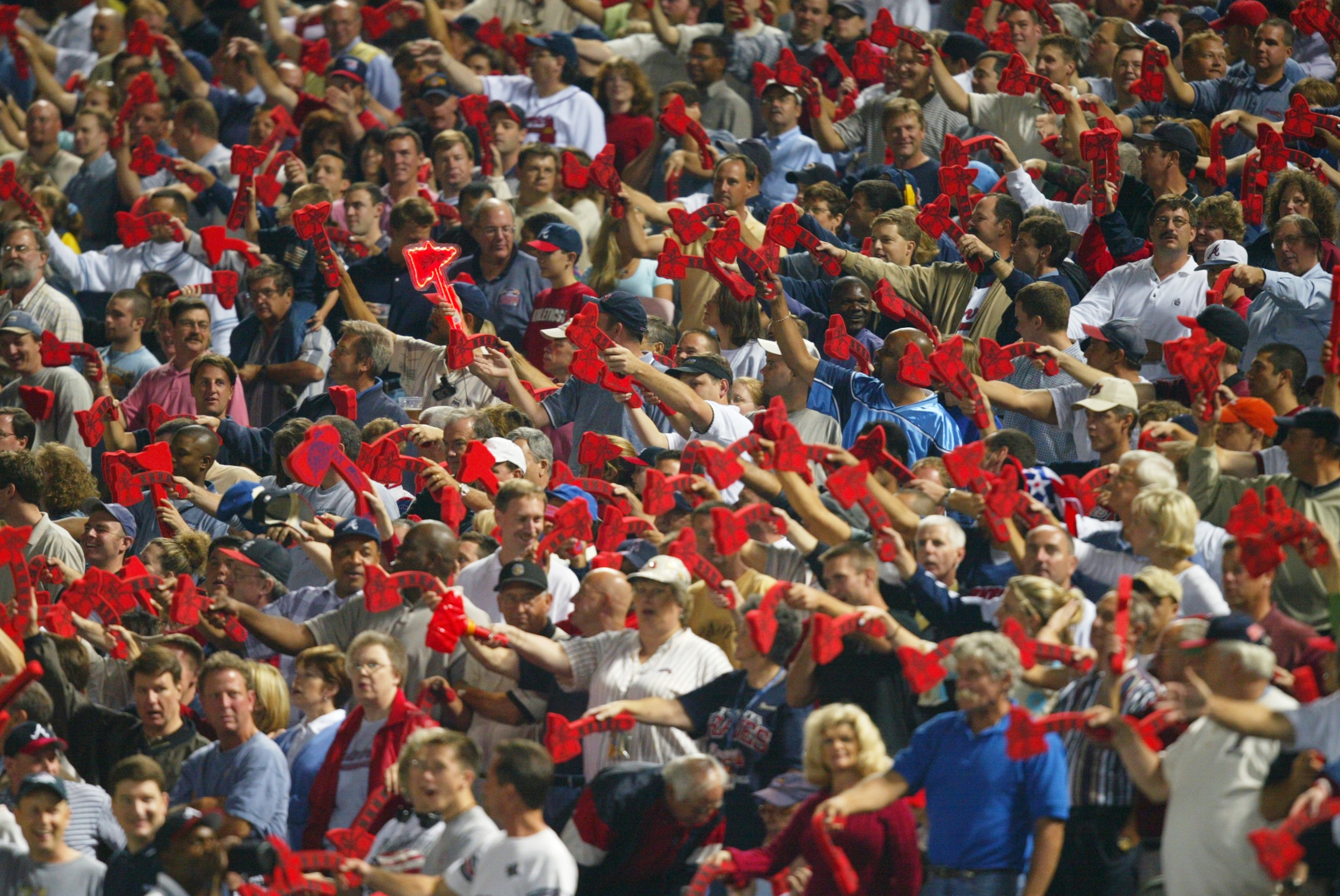 ATLANTA - OCTOBER 7:  Fans of the Atlanta Braves do the tomahawk chop during game five of the National League Division Series against the San Francisco Giants on October 7, 2002  at Turner Field in Atlanta, Georgia.  The Giants won 3-1.  (Photo by Jamie S