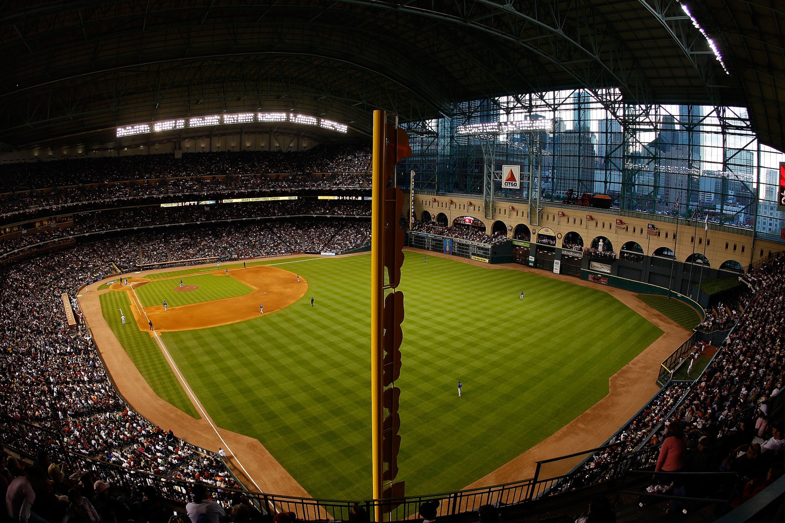 HOUSTON - APRIL 06:  Fans watch the Opening Day game against the Chicago Cubs and the Houston Astros on April 6, 2009 at Minute Maid Park in Houston, Texas.  (Photo by Chris Graythen/Getty Images)