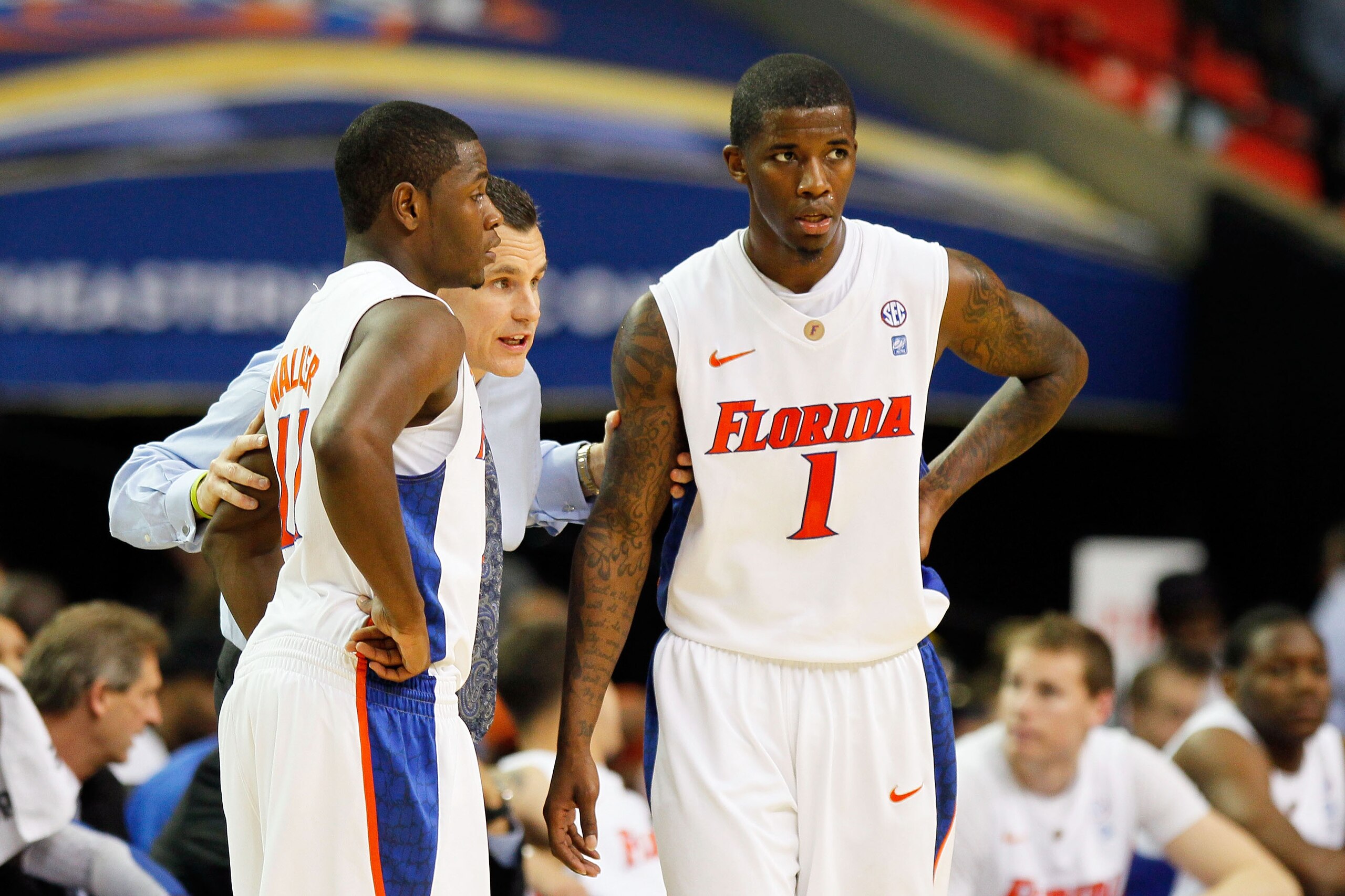ATLANTA, GA - MARCH 12: Head coach Billy Donovan talks to Kenny Boynton #1 and Erving Walker #11 of the Florida Gators during their 77 to 66 win over the Vanderbilt Commodores the semifinals of the SEC Men's Basketball Tournament at Georgia Dome on March ATLANTA, GA - MARCH 12: Head coach Billy Donovan talks to Kenny Boynton #1 and Erving Walker #11 of the Florida Gators during their 77 to 66 win over the Vanderbilt Commodores the semifinals of the SEC Men's Basketball Tournament at Georgia Dome on March