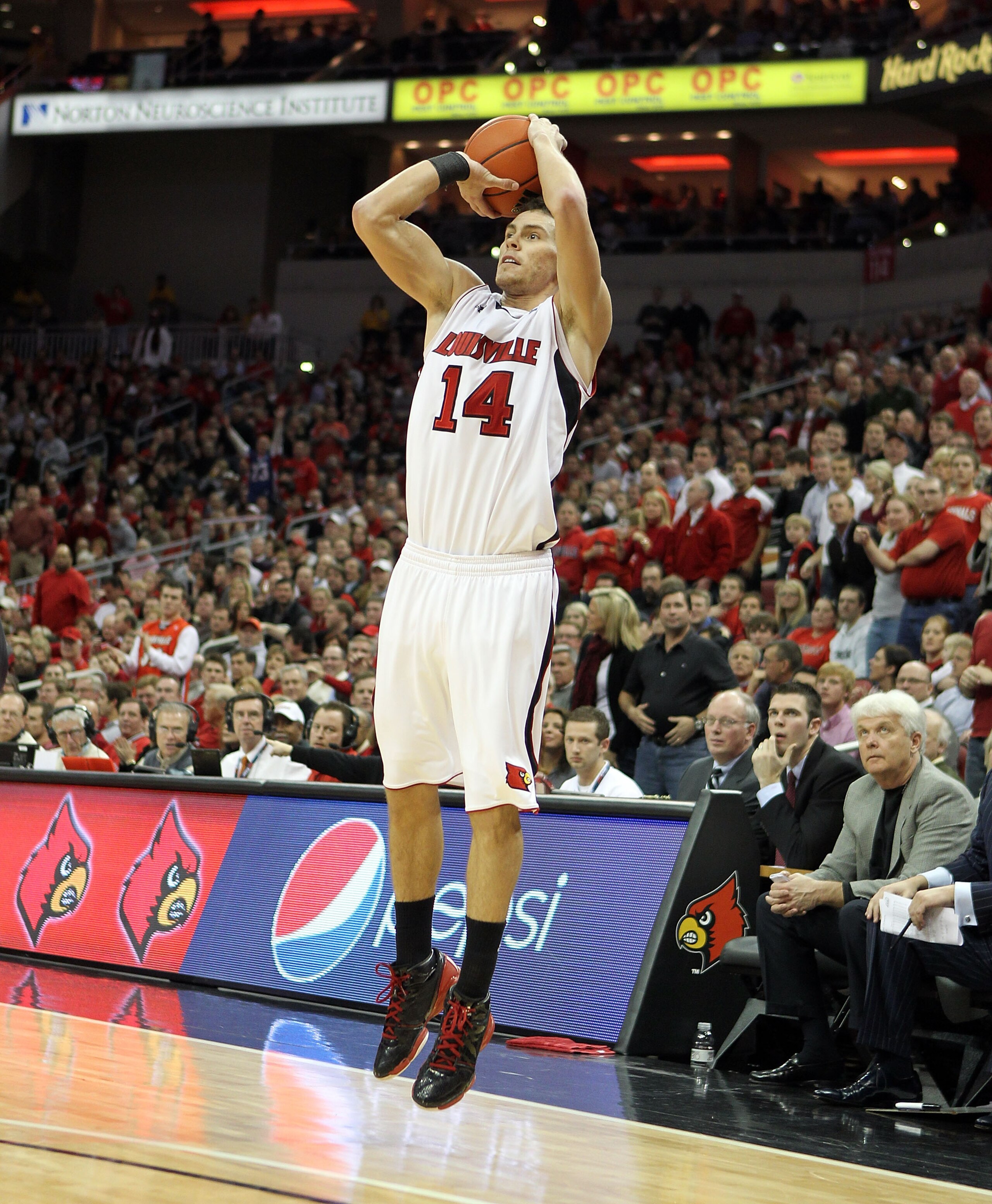 LOUISVILLE, KY - JANUARY 19: Kyle Kuric #14 of the Louisville Cardinals shoots the ball during the Big East Conference game against the St. John's Red Storm at the KFC Yum! Center on January 19, 2011 in Louisville, Kentucky.  Louisville won 88-63.  (Photo