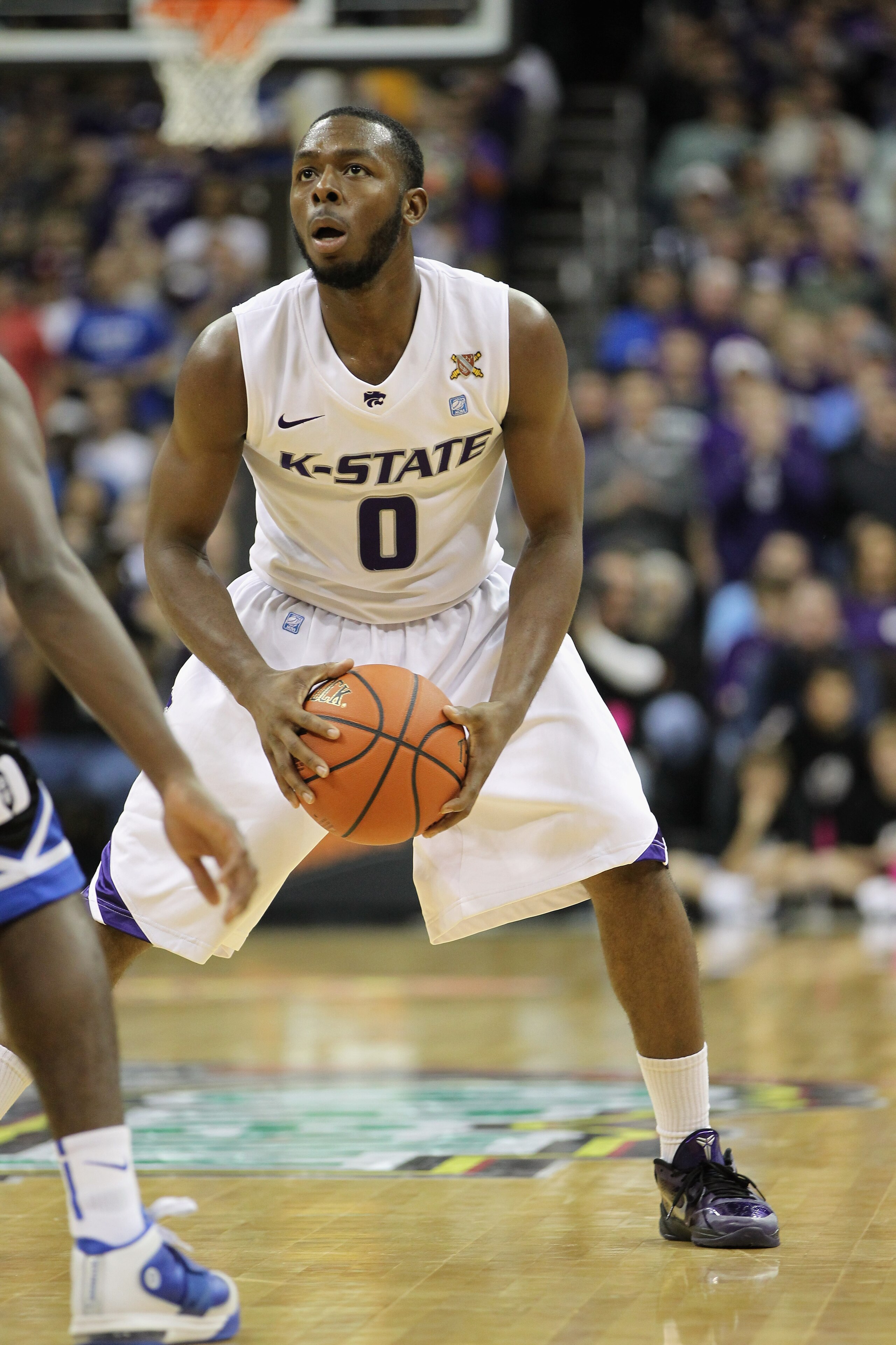 KANSAS CITY, MO - NOVEMBER 23:  Jacob Pullen #0 of the Kansas State Wildcats in action during the CBE Classic championship game against the Duke Blue Devils on November 23, 2010 at the Sprint Center in Kansas City, Missouri.  (Photo by Jamie Squire/Getty