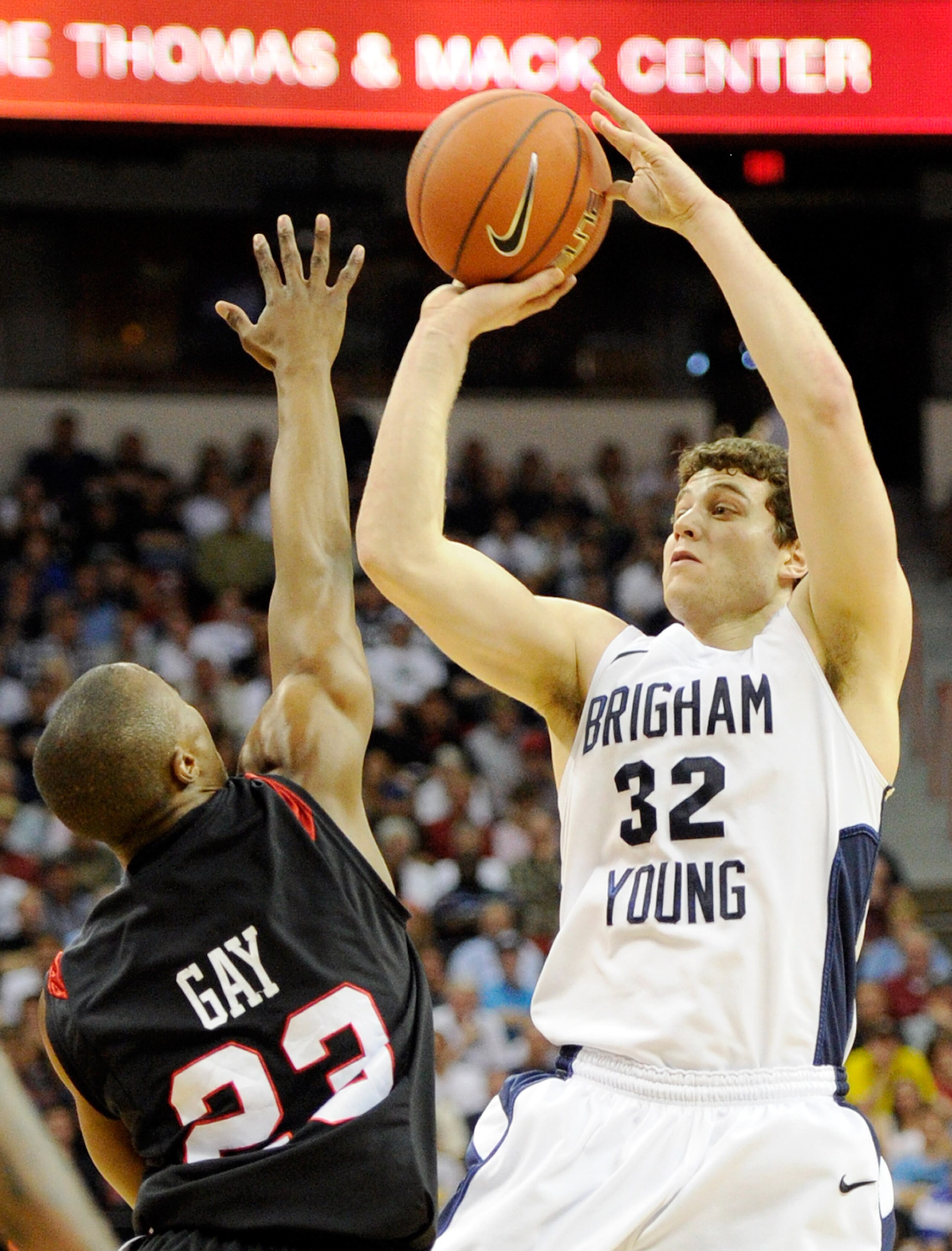 LAS VEGAS, NV - MARCH 12:  Jimmer Fredette #32 of the Brigham Young University Cougars shoots against D.J. Gay #23 of the San Diego State Aztecs during the championship game of the Conoco Mountain West Conference Basketball tournament at the Thomas & Mack