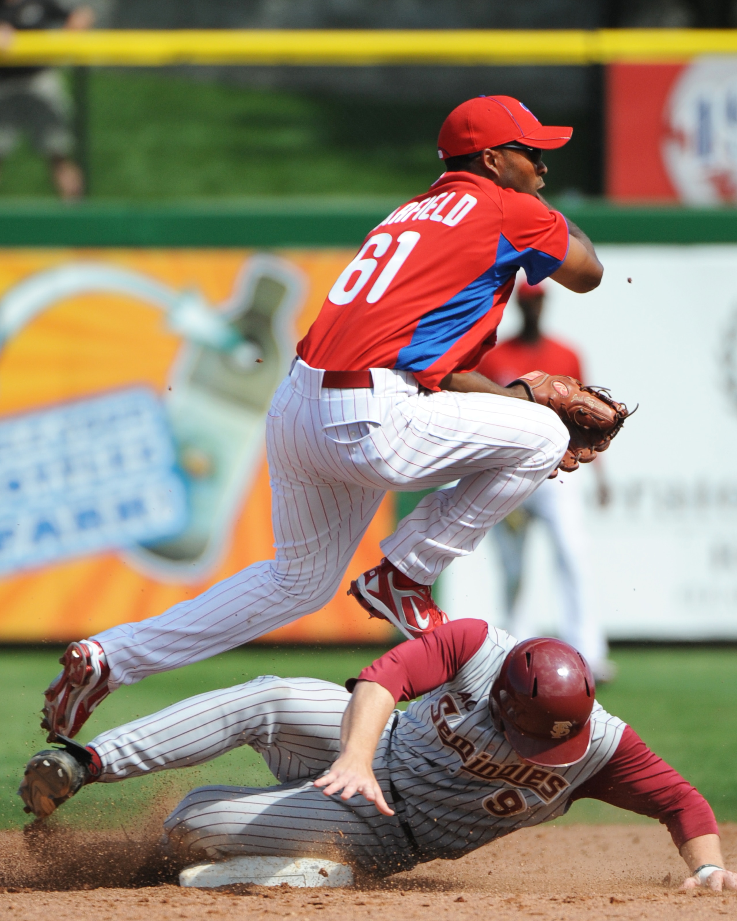 CLEARWATER, FL - FEBRUARY 24:  Infielder Josh Barfield #61 of the Philadelphia Phillies throws to first base against the Florida State Seminoles February 24, 2011 at Bright House Field in Clearwater, Florida.  (Photo by Al Messerschmidt/Getty Images)