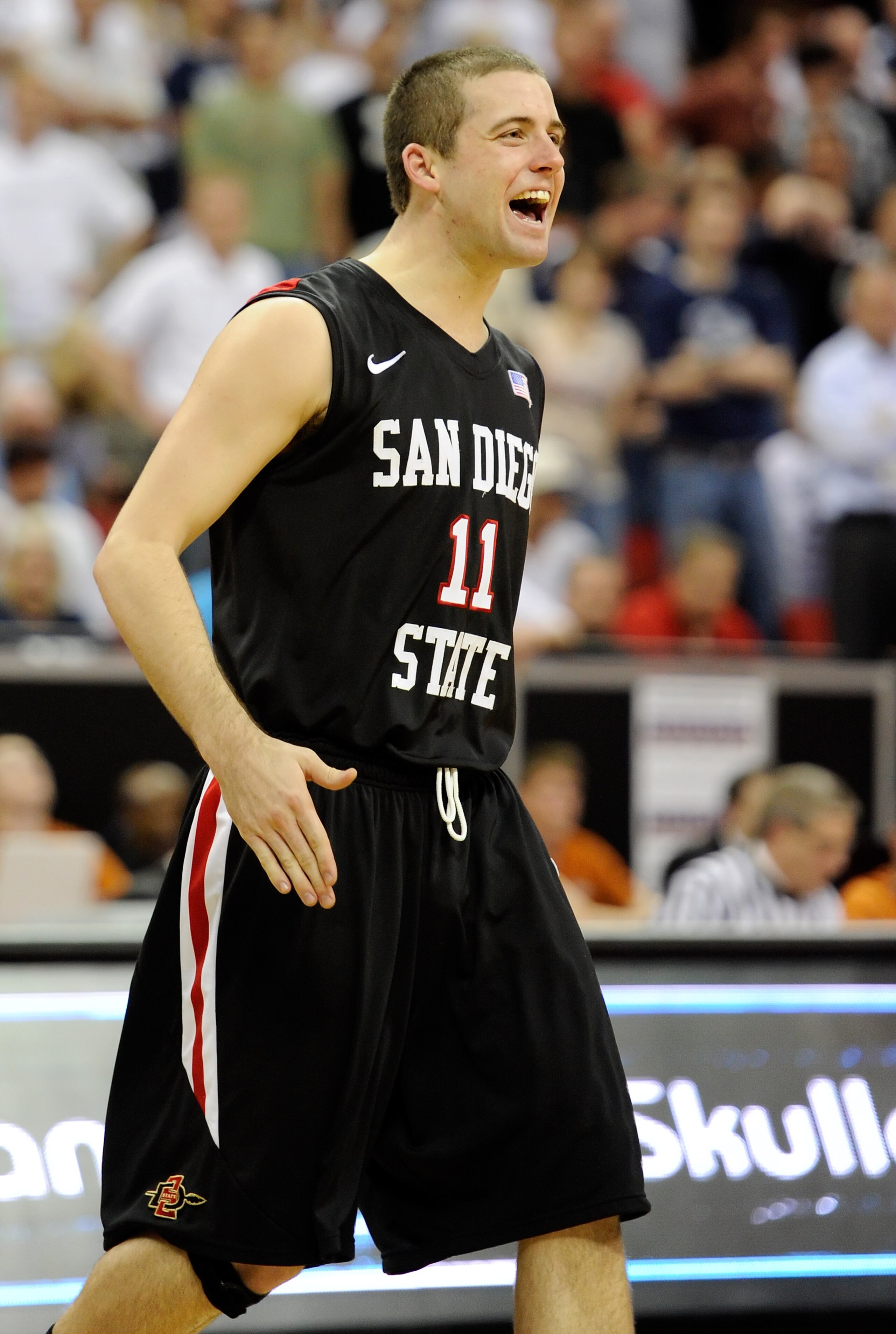 LAS VEGAS, NV - MARCH 12:  James Rahon #11 of the San Diego State Aztecs celebrates during the team's 72-54 victory over the Brigham Young University Cougars in the championship game of the Conoco Mountain West Conference Basketball tournament at the Thom