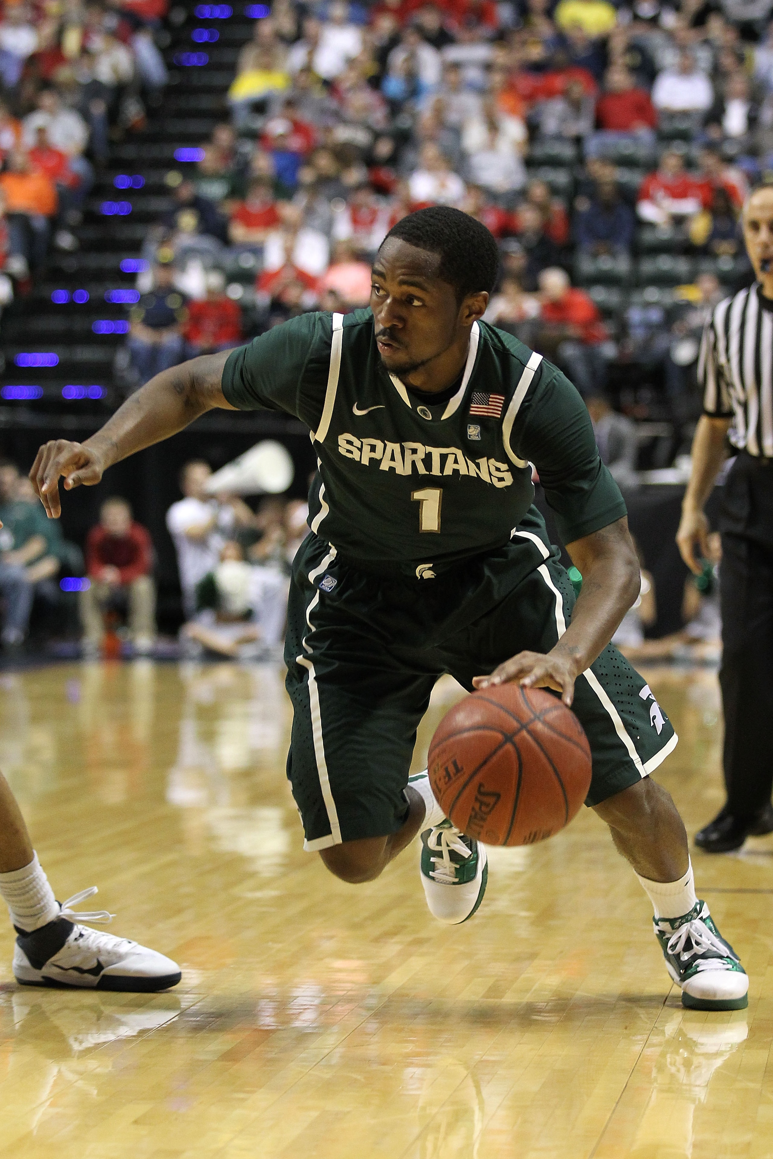 INDIANAPOLIS, IN - MARCH 12:  Kalin Lucas #1 of the Michigan State Spartans drives against Penn State Nittany Lions during the semifinals of the 2011 Big Ten Men's Basketball Tournament at Conseco Fieldhouse on March 12, 2011 in Indianapolis, Indiana.  (P