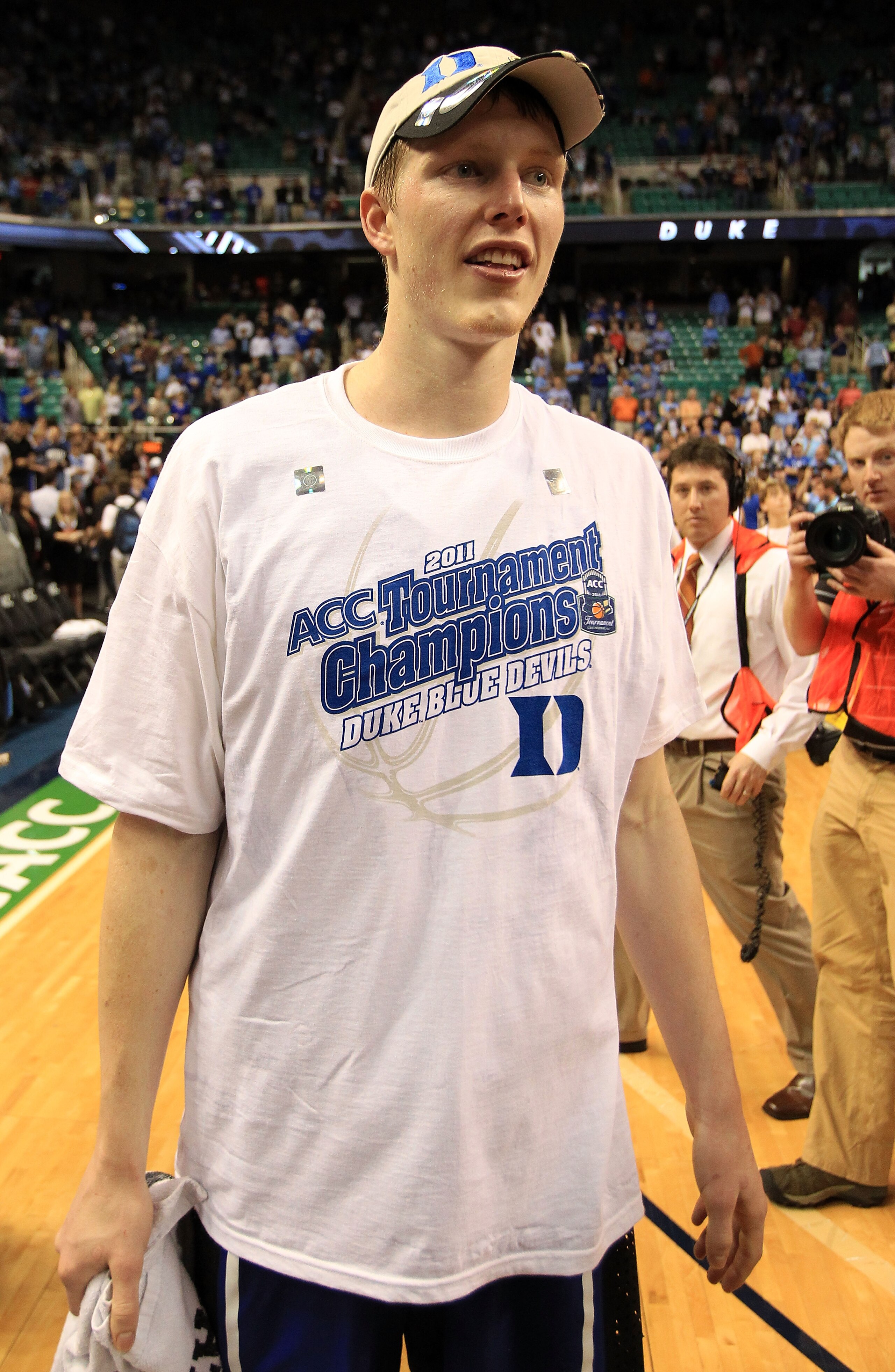 GREENSBORO, NC - MARCH 13: Kyle Singler #12 of the Duke Blue Devils smiles after defeating the North Carolina Tar Heels 75-58 in the championship game of the 2011 ACC men's basketball tournament at the Greensboro Coliseum on March 13, 2011 in Greensboro, GREENSBORO, NC - MARCH 13: Kyle Singler #12 of the Duke Blue Devils smiles after defeating the North Carolina Tar Heels 75-58 in the championship game of the 2011 ACC men's basketball tournament at the Greensboro Coliseum on March 13, 2011 in Greensboro,