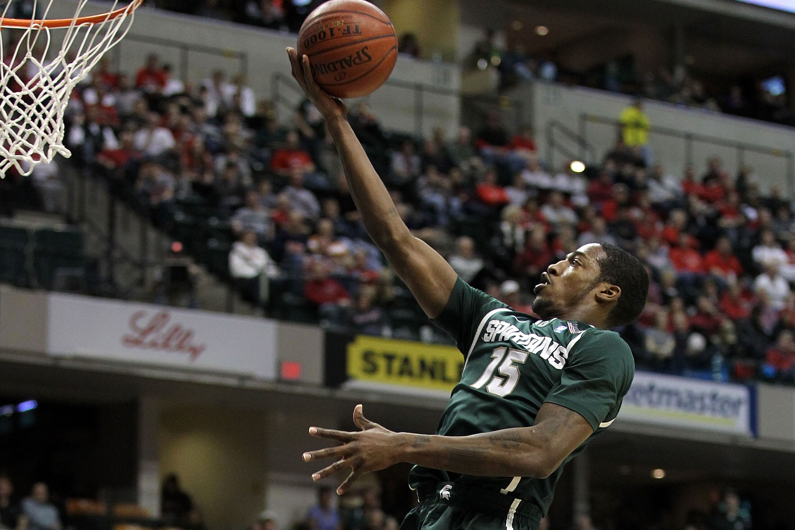 INDIANAPOLIS, IN - MARCH 12:  Durrell Summers #15 of the Michigan State Spartans drives for a shot attempt against the Penn State Nittany Lions during the semifinals of the 2011 Big Ten Men's Basketball Tournament at Conseco Fieldhouse on March 12, 2011 i