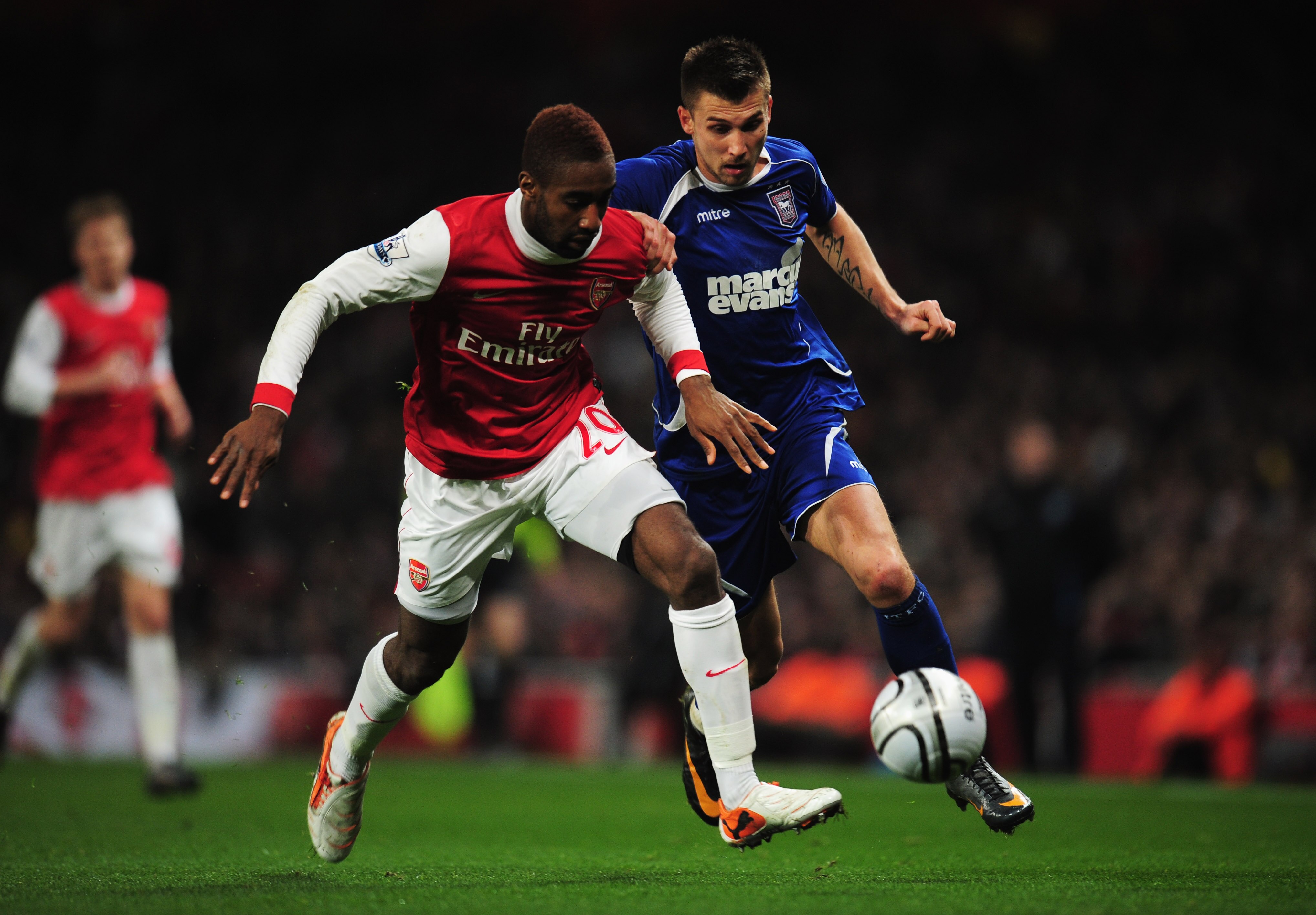LONDON, ENGLAND - JANUARY 25:   Johan Djourou of Arsenal battles with Tamas Priskin of Ipswich Town during the Carling Cup Semi Final Second Leg match between Arsenal and Ipswich Town at Emirates Stadium on January 25, 2011 in London, England.  (Photo by