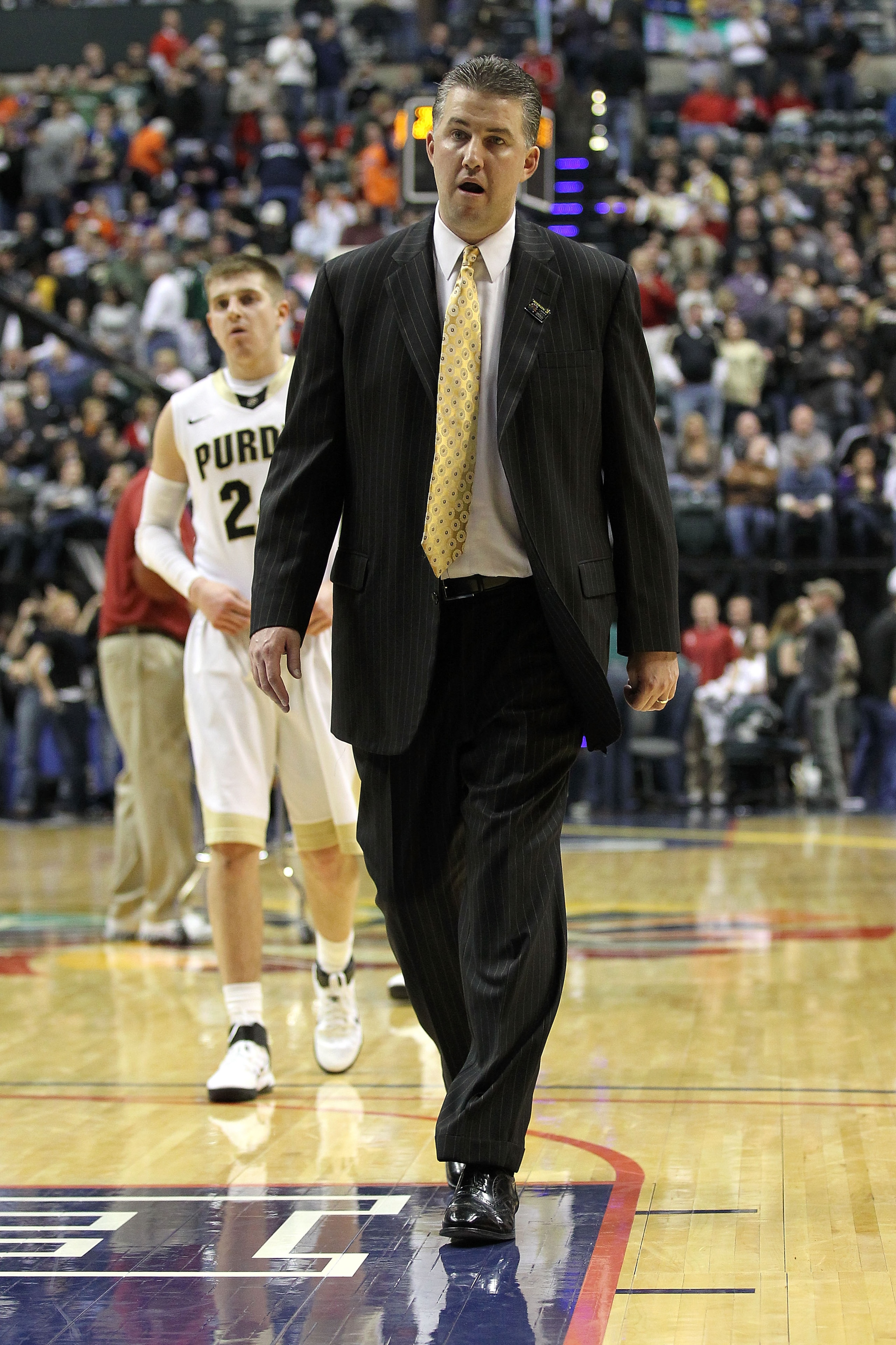 INDIANAPOLIS, IN - MARCH 11:  Head coach Matt Painter of the Purdue Boilermakers  walks off the court dejected after they lost 74-56 against the Michigan State Spartans during the quarterfinals of the 2011 Big Ten Men's Basketball Tournament at Conseco Fi