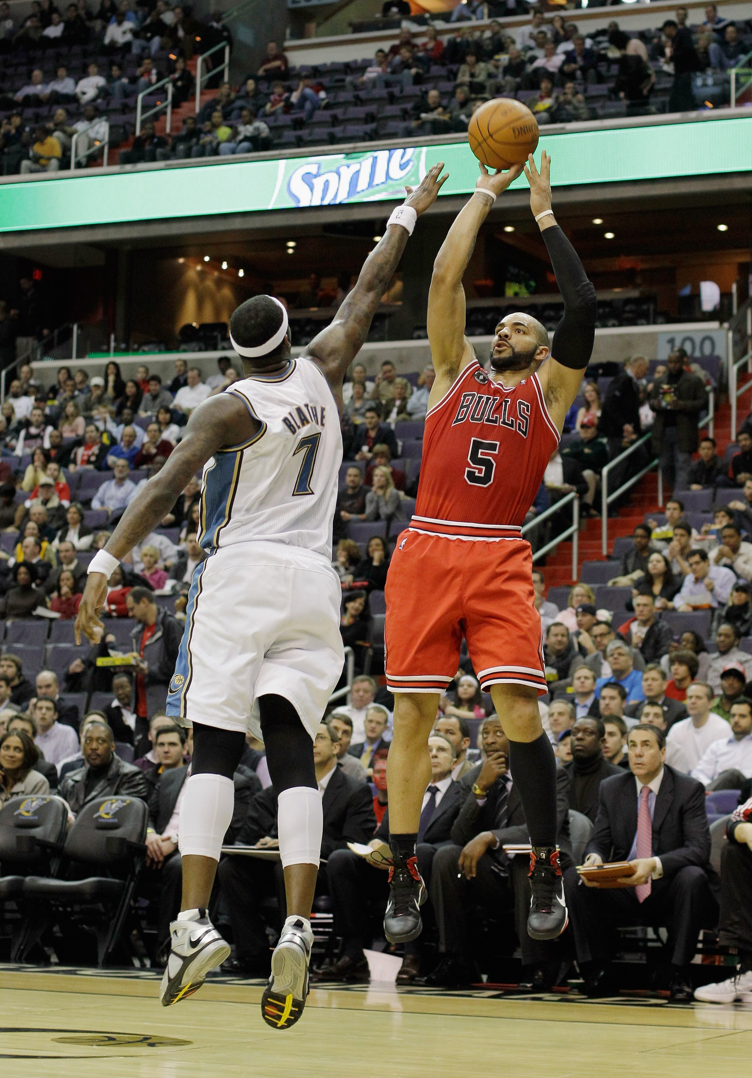 WASHINGTON, DC - FEBRUARY 28: Carlos Boozer #5 of the Chicago Bulls shoots over the defense of Andray Blatche #7 of the Washington Wizards at the Verizon Center in Washington on February 28, 2011 in Washington, DC. NOTE TO USER: User expressly acknowledge