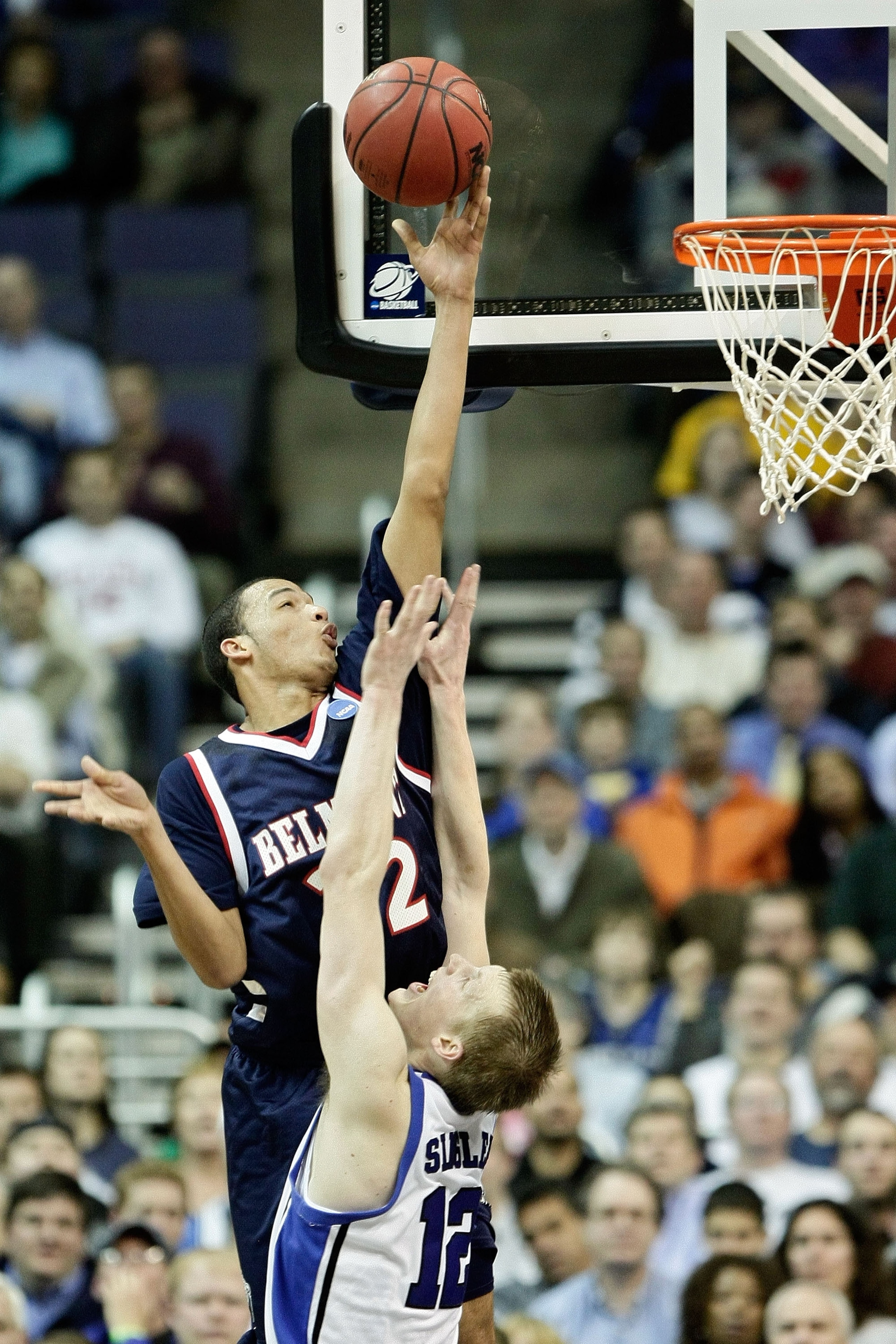 WASHINGTON - MARCH 20:  Jordan Campbell #32 of the Belmont Bruins goes to the hoop against Kyle Singler #12 of the Duke Blue Devils during the first round of the West Regional as part of the 2008 NCAA Men's Basketball Tournament at the Verizon Center on M
