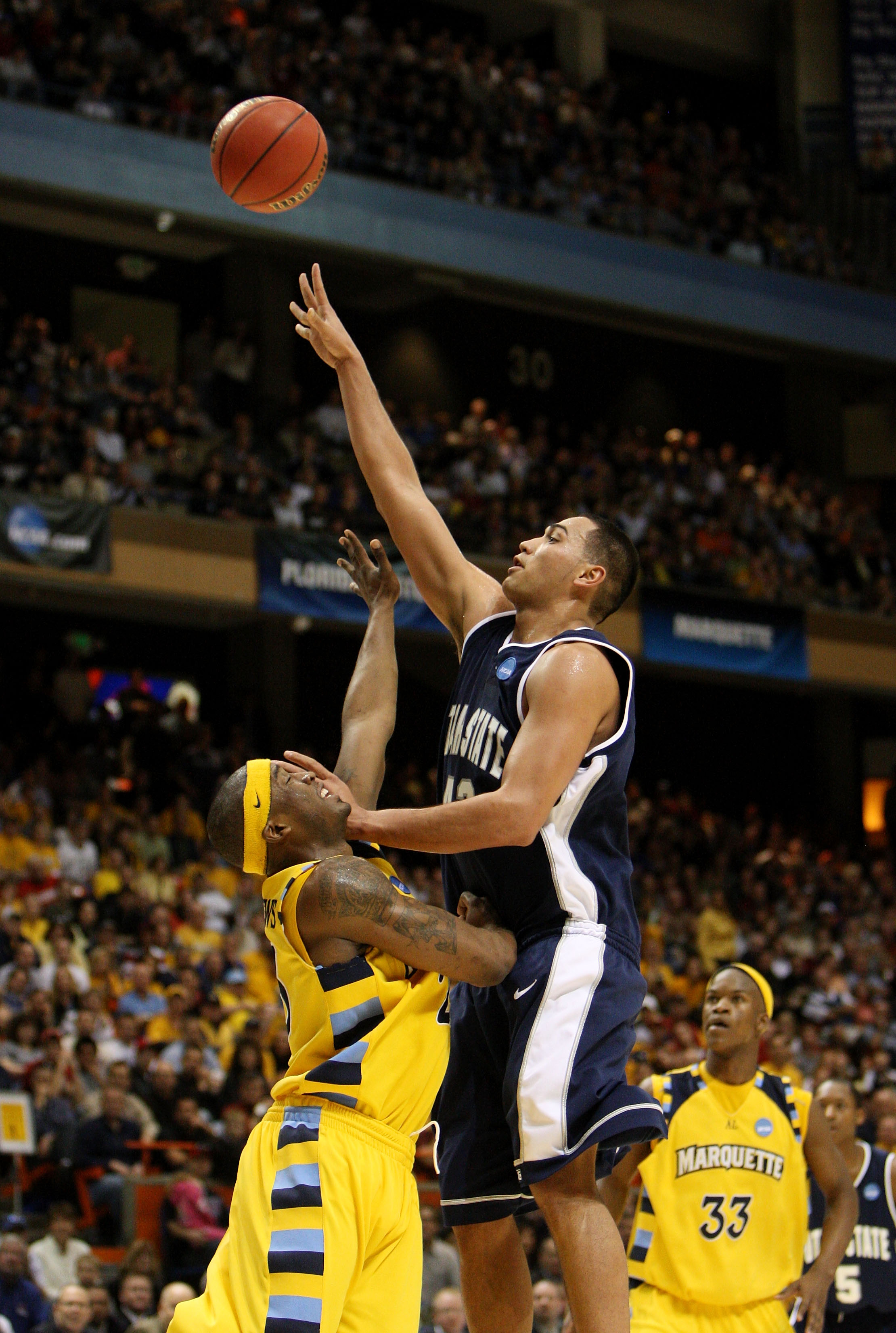 BOISE, ID - MARCH 20: Forward Tai Wesley #42 of the Utah State Aggies shoots ball against the Marquette Golden Eagles in the first round of the NCAA Division I Men's Basketball Tournament at the Taco Bell Arena on March 20, 2009 in Boise, Idaho. (Photo