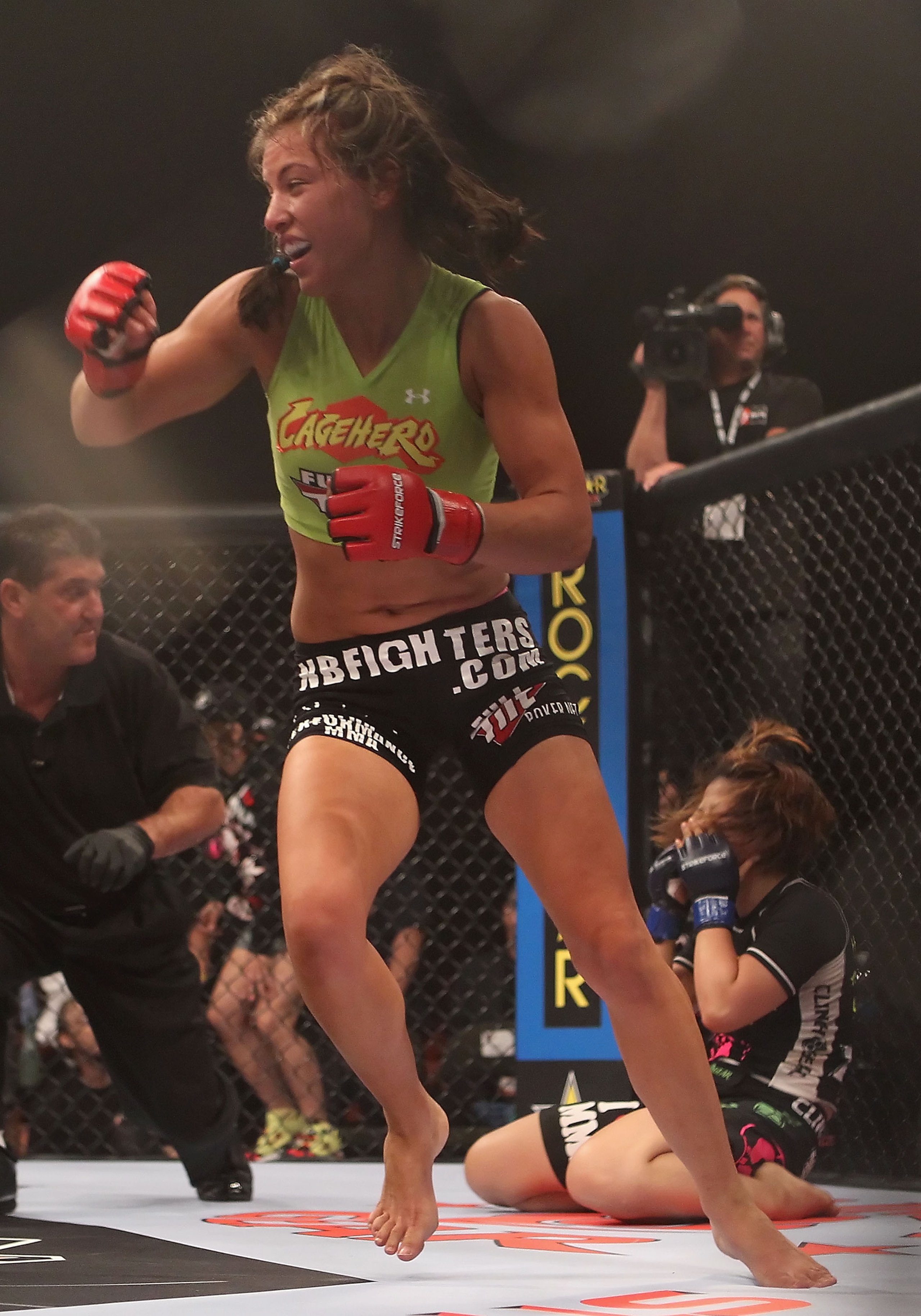 PHOENIX - AUGUST 13: Miesha Tate celebrates after defeating Hitomi Akano of Japan in the Strikeforce Women's Welterweight Tournament Championship bout at Dodge Theater on August 13, 2010 in Phoenix, Arizona. (Photo by Christian Petersen/Getty Images) PHOENIX - AUGUST 13: Miesha Tate celebrates after defeating Hitomi Akano of Japan in the Strikeforce Women's Welterweight Tournament Championship bout at Dodge Theater on August 13, 2010 in Phoenix, Arizona. (Photo by Christian Petersen/Getty Images)