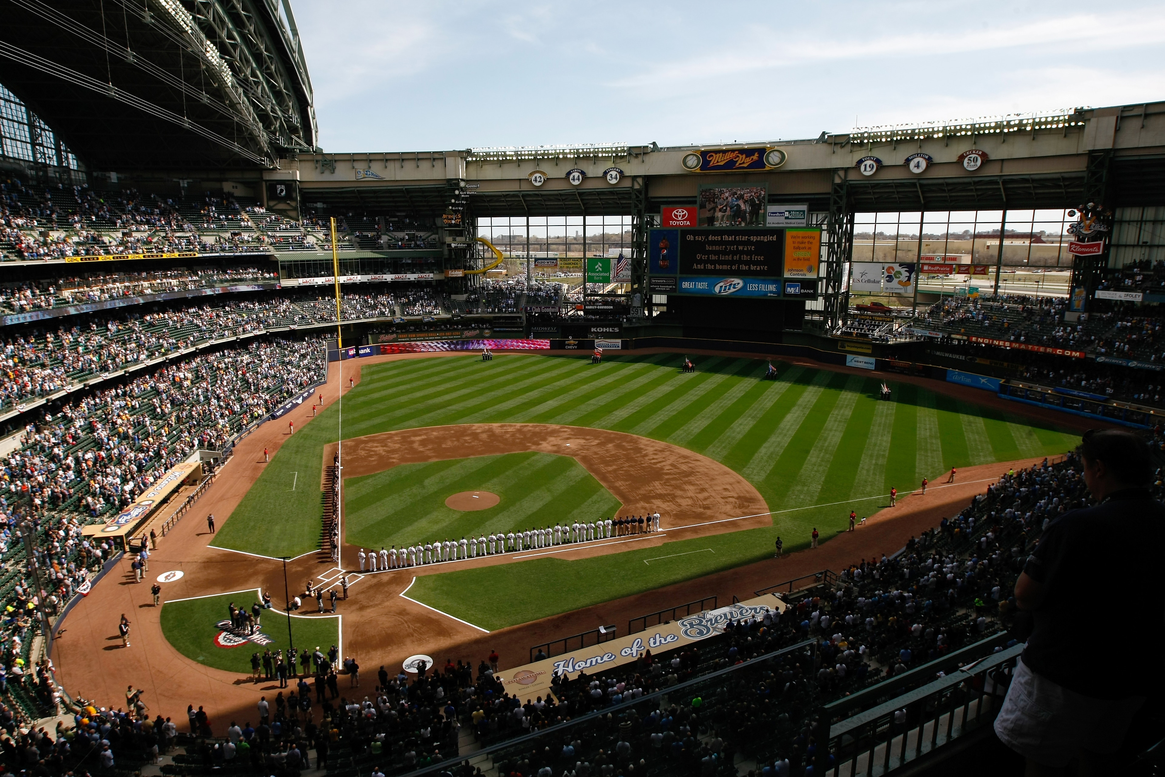 MILWAUKEE, WI - APRIL 05: The Colorado Rockies and Milwaukee Brewers line up on the base lines after introductions during the National Anthem prior to the game between the Colorado Rockies against the Milwaukee Brewers at the Miller Park on April 05, 2010 MILWAUKEE, WI - APRIL 05: The Colorado Rockies and Milwaukee Brewers line up on the base lines after introductions during the National Anthem prior to the game between the Colorado Rockies against the Milwaukee Brewers at the Miller Park on April 05, 2010