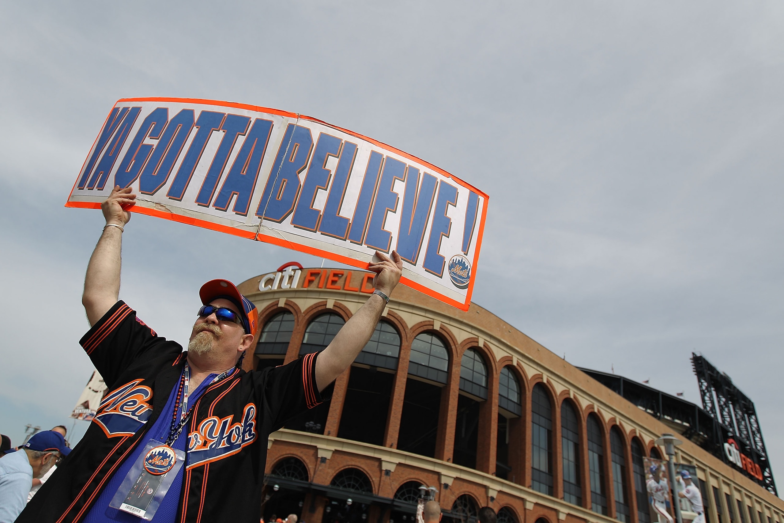 NEW YORK - APRIL 05:  Fans outside the stadium prior to the Opening Day Game between the New York Mets and the Florida Marlins at Citi Field on April 5, 2010 in the Flushing neighborhood of the Queens borough of New York City.  (Photo by Nick Laham/Getty