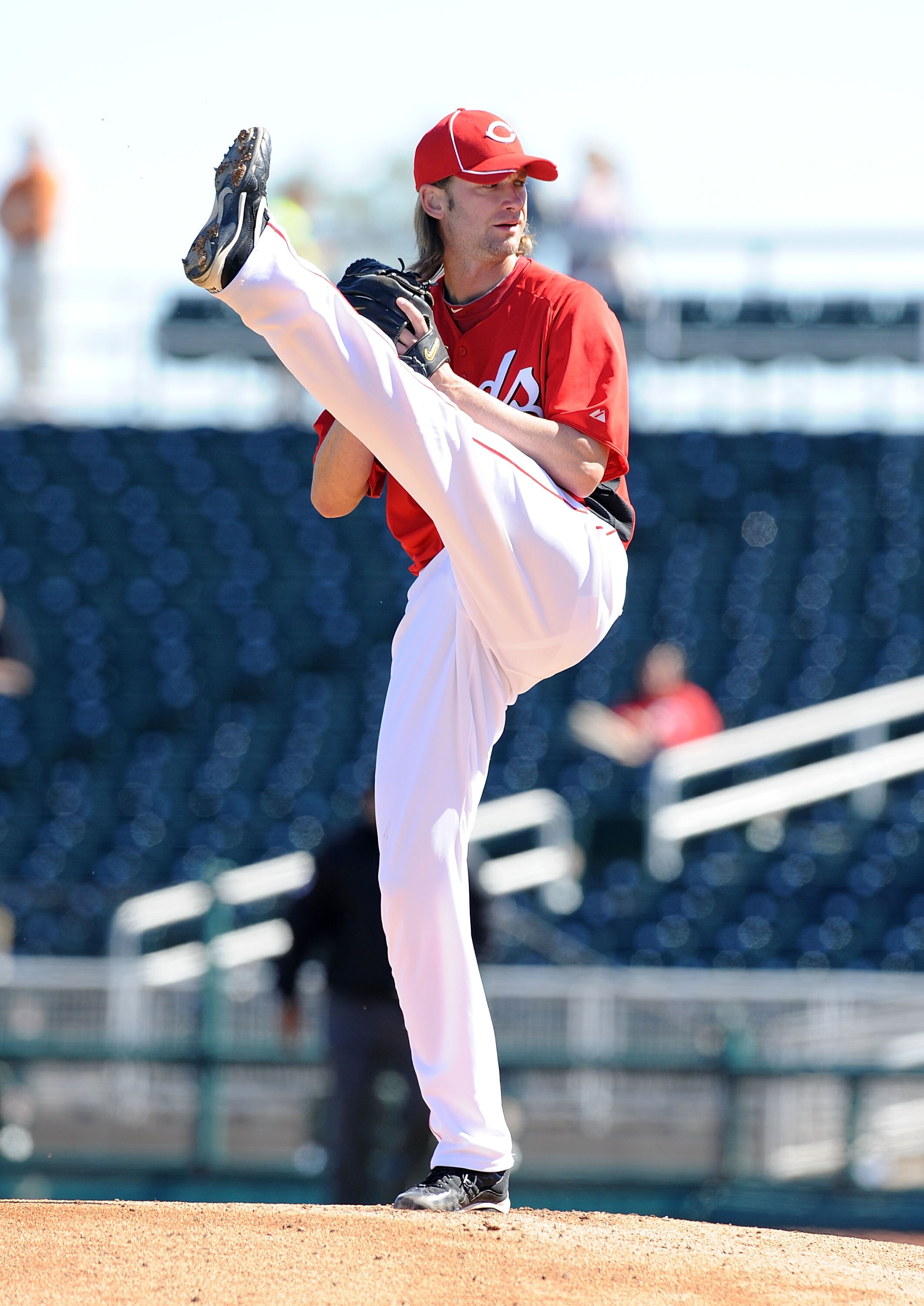 GOODYEAR, AZ - FEBRUARY 28:  Bronson Arroyo #61 of the Cincinnati Reds gets ready to deliver a pitch against the Cleveland Indians at Goodyear Ballpark on February 28, 2011 in Goodyear, Arizona.  (Photo by Norm Hall/Getty Images)