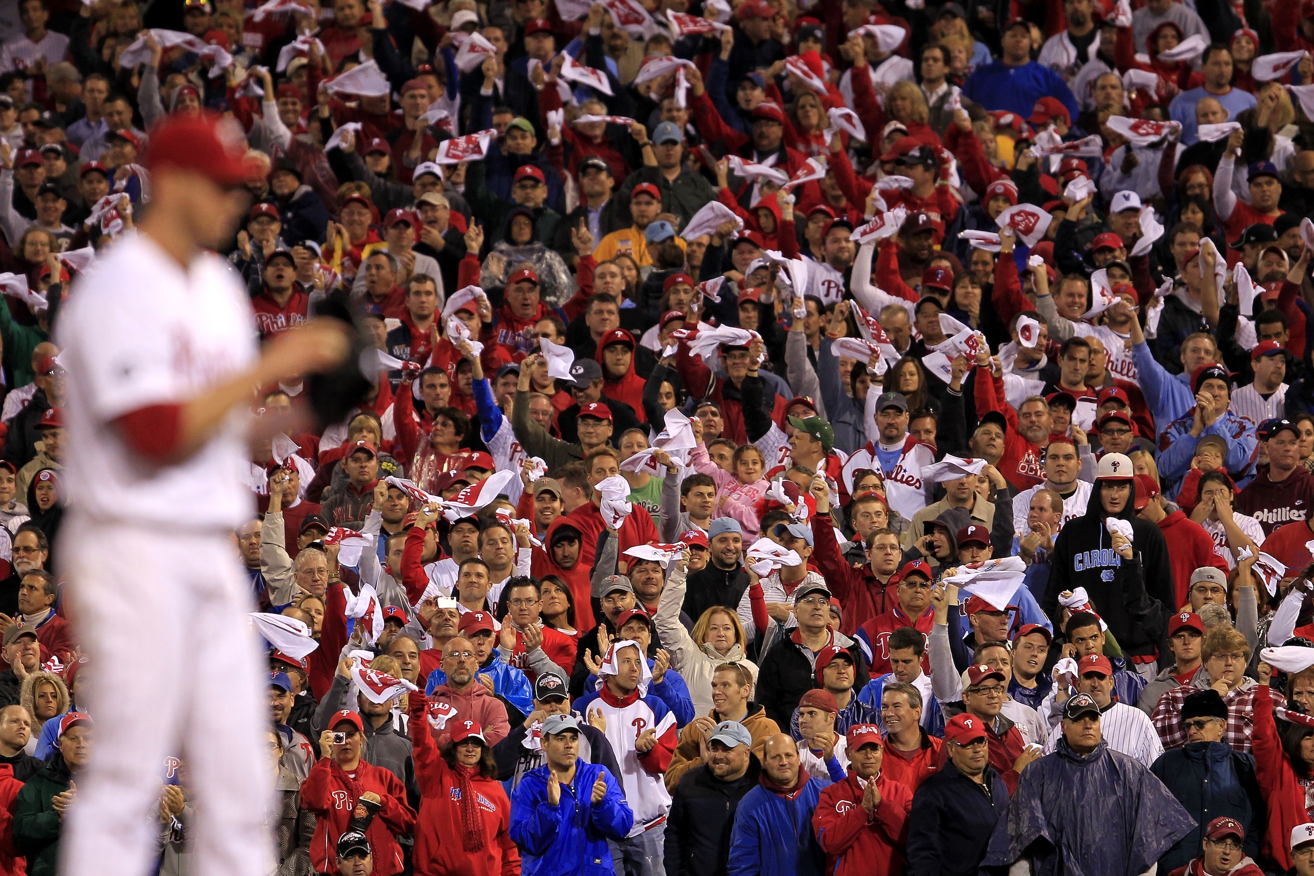 PHILADELPHIA - OCTOBER 06:  Fans cheer on pitcher Roy Halladay #34 of the Philadelphia Phillies as he prepares to pitch during his no-hitter in Game 1 of the NLDS against the Cincinnati Reds at Citizens Bank Park on October 6, 2010 in Philadelphia, Pennsy