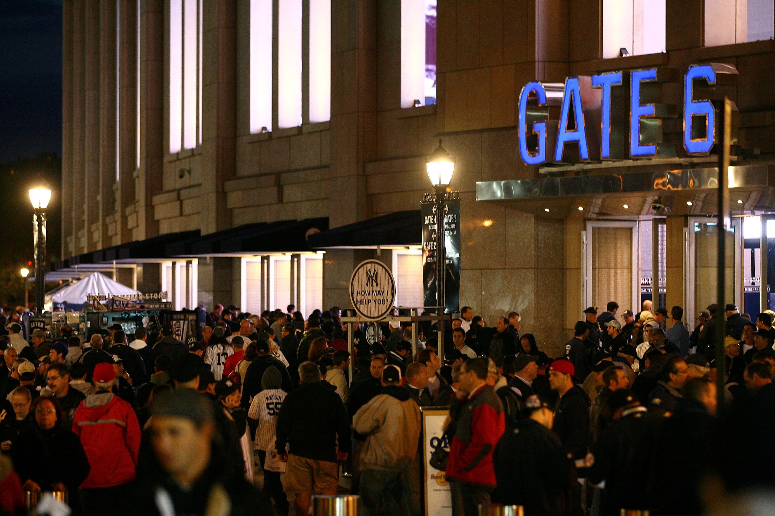 NEW YORK - OCTOBER 18:  Fans walks outside of Yankee Stadium before Game Three of the ALCS between the New York Yankees and the Texas Rangers during the 2010 MLB Playoffs at Yankee Stadium on October 18, 2010 in New York, New York.  (Photo by Andrew Burto