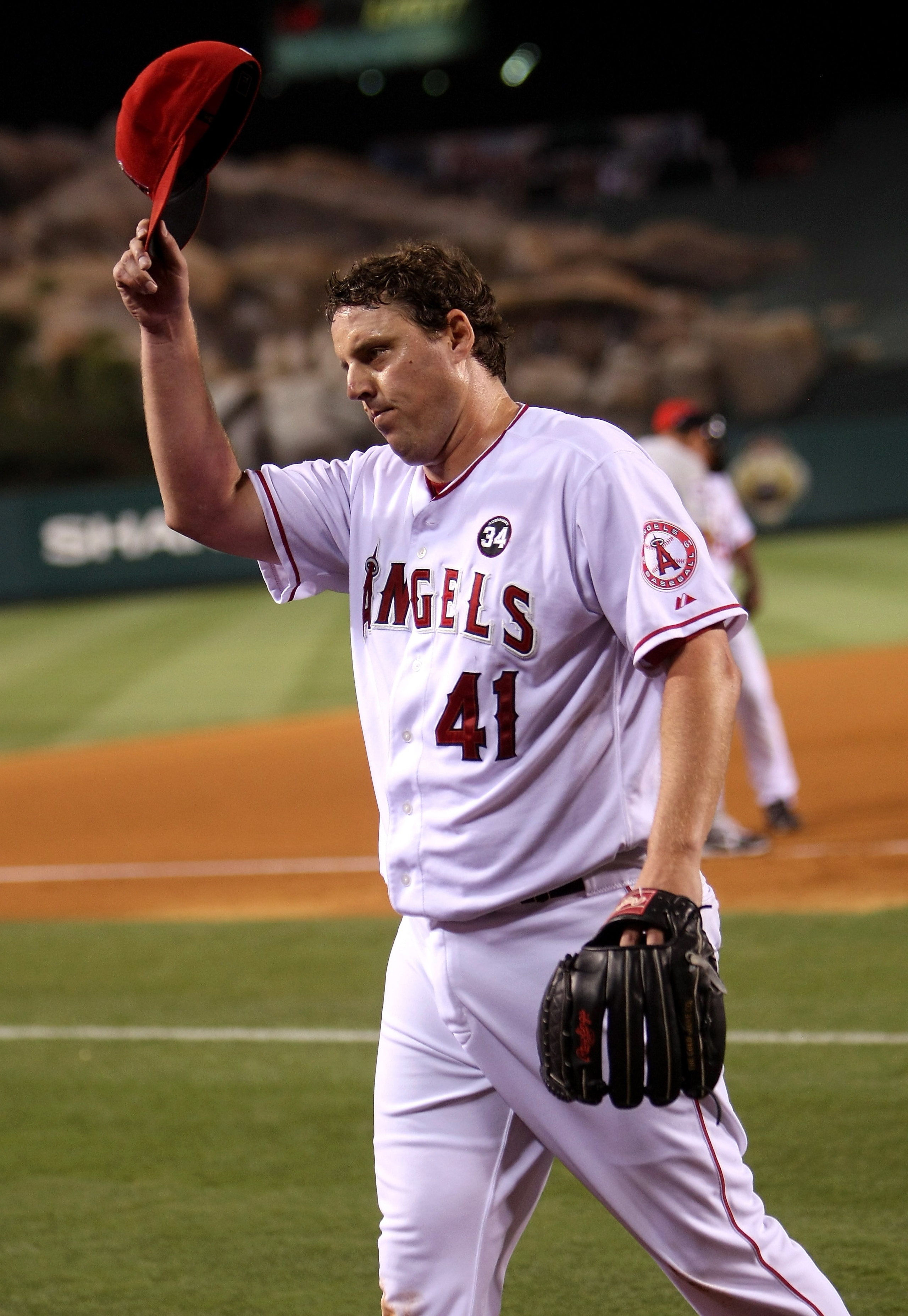 ANAHEIM, CA - JULY 24:  John Lackey #41 of the Los Angeles Angels of Anaheim tips his cap to the crowd after being relieved in the eighth inning against the Minnesota Twins on July 24, 2009 at Angel Stadium in Anaheim, California.  (Photo by Stephen Dunn/
