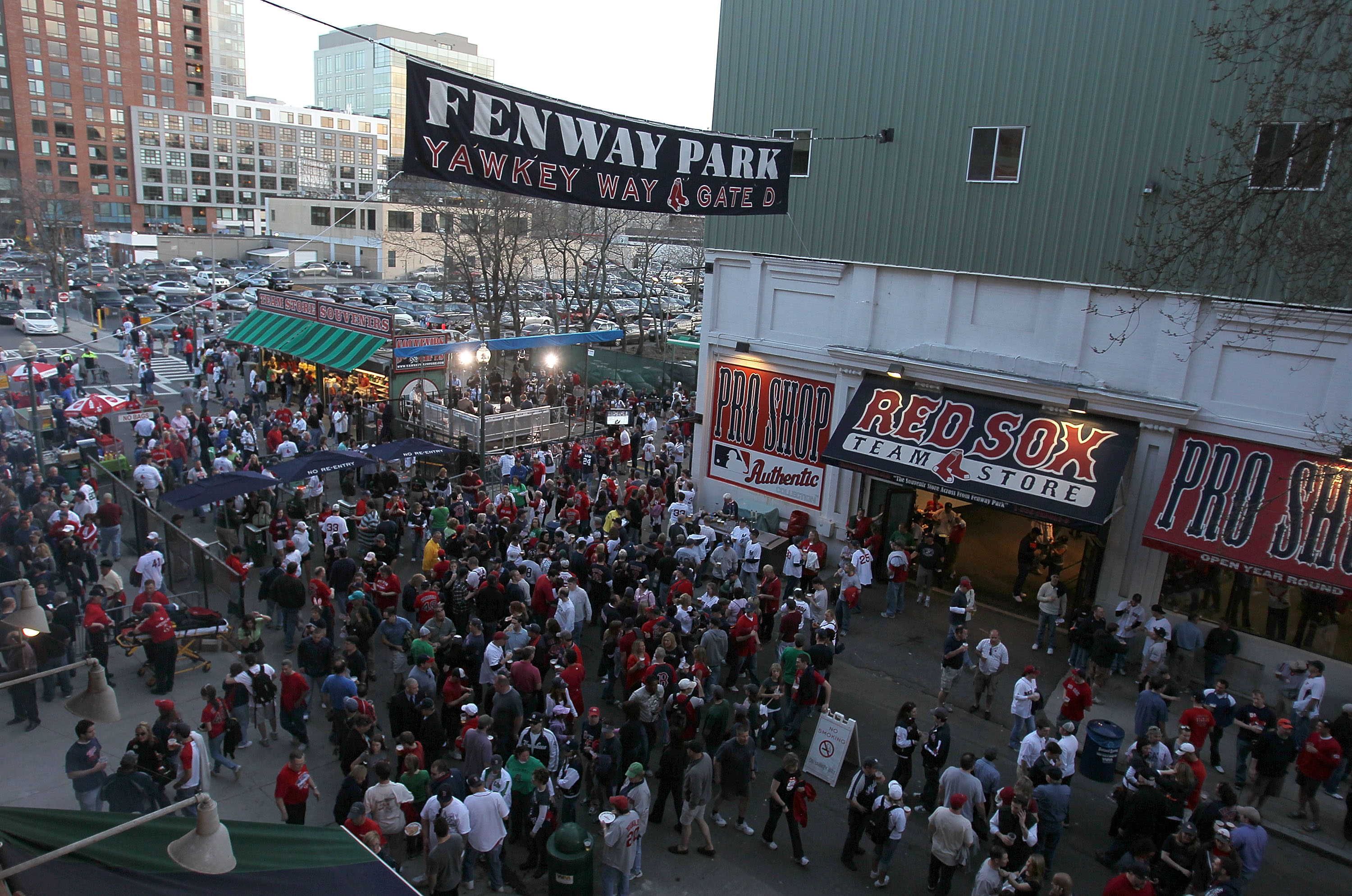 BOSTON - APRIL 04: Fans enter Yawkey Way before a game between the Boston Red Sox and the New York Yankees on Opening Night at Fenway Park on April 4, 2010 in Boston, Massachusetts. (Photo by Jim Rogash/Getty Images)