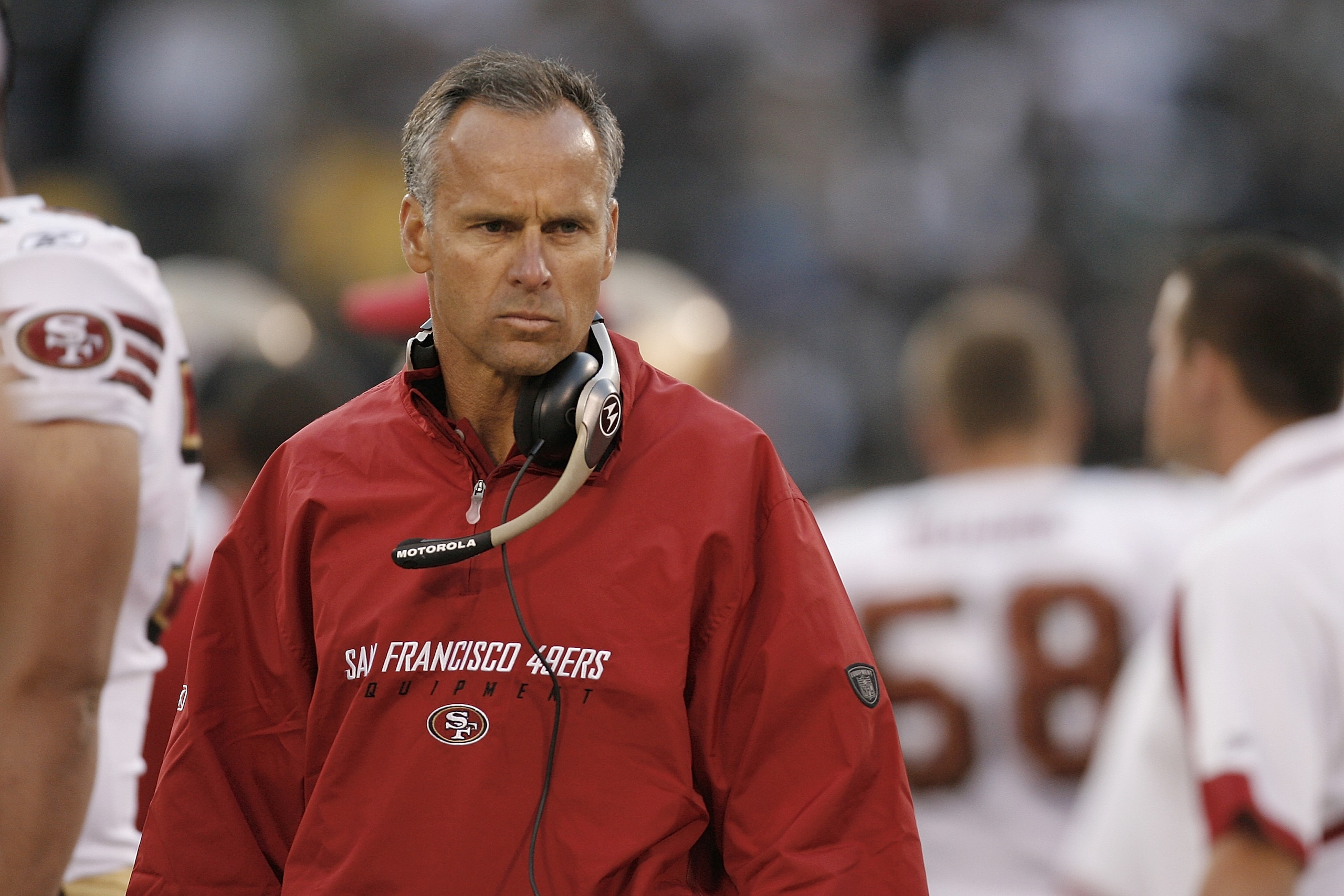 OAKLAND, CA - AUGUST 08: Head coach Mike Nolan of the San Francisco 49ers scowls on the sidelines during a preseason game against the Oakland Raiders on August 8, 2008, at the McAfee Coliseum in Oakland, California. (Photo by Greg Trott/Getty Images) OAKLAND, CA - AUGUST 08: Head coach Mike Nolan of the San Francisco 49ers scowls on the sidelines during a preseason game against the Oakland Raiders on August 8, 2008, at the McAfee Coliseum in Oakland, California. (Photo by Greg Trott/Getty Images)