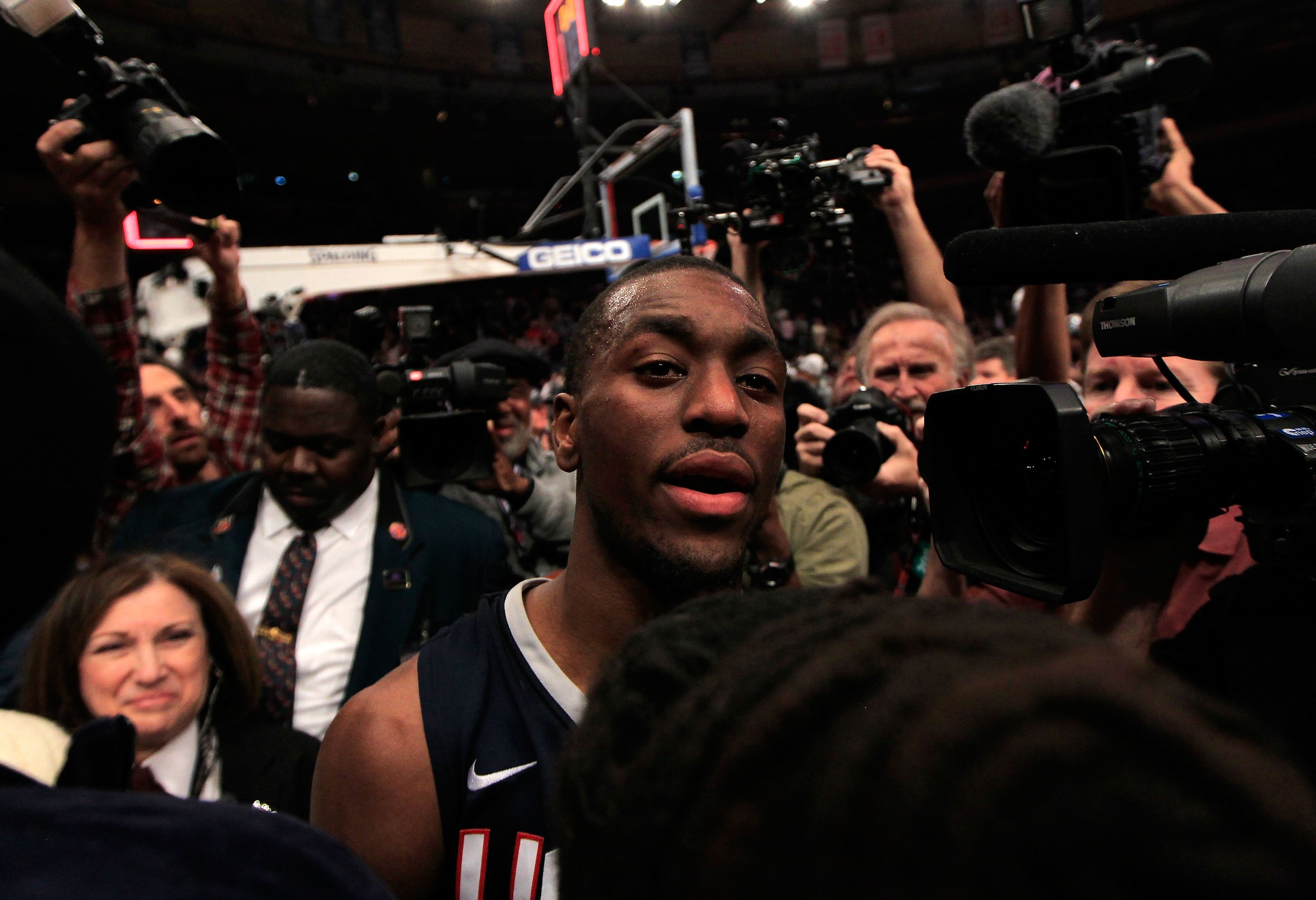 NEW YORK, NY - MARCH 12: Kemba Walker #15 of the Connecticut Huskies is surrounded by media after defeating the Louisville Cardinals during the championship of the 2011 Big East Men's Basketball Tournament presented by American Eagle Outfitters at Madison