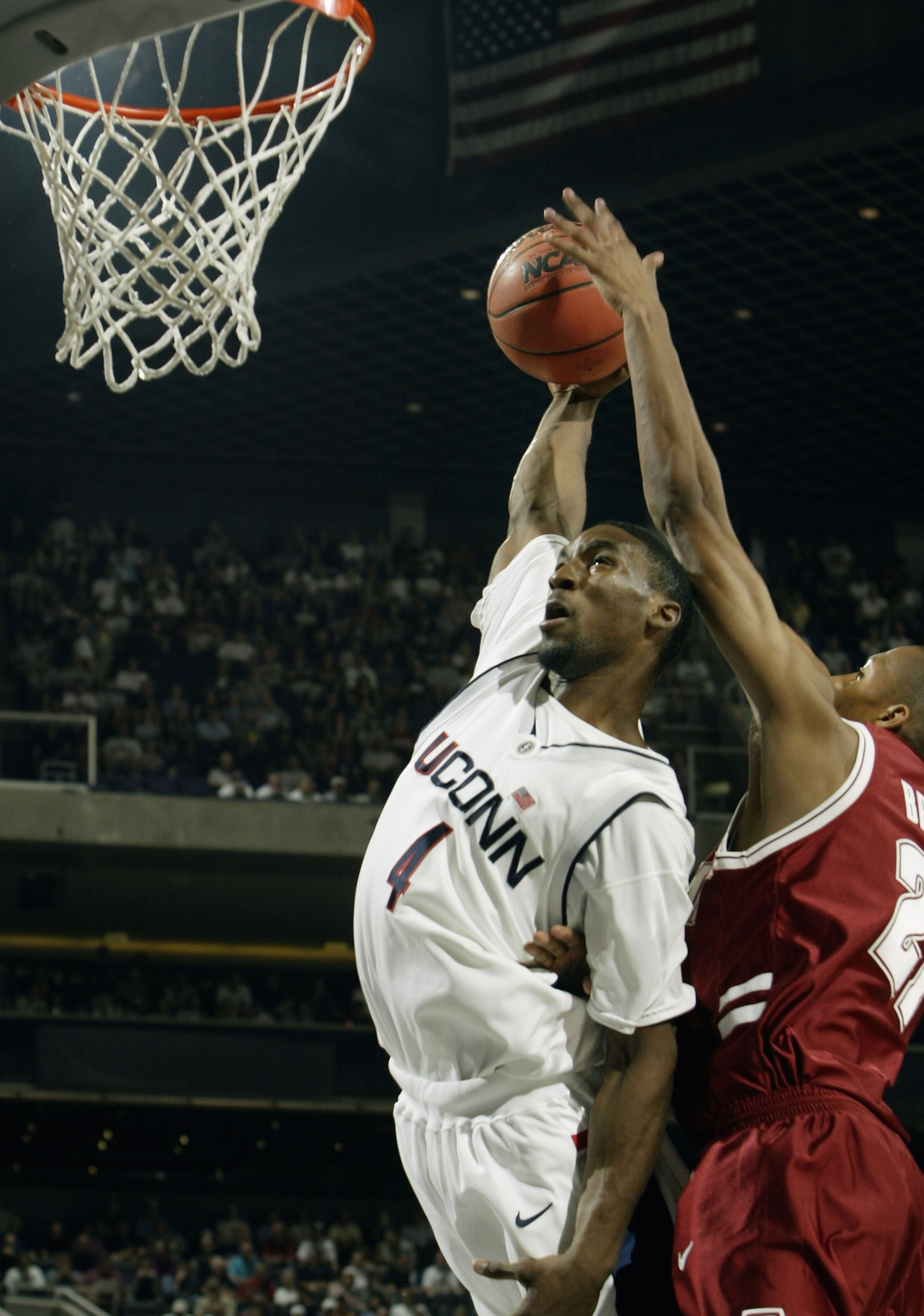 PHOENIX - MARCH 27:  Ben Gordon #4 of the University of Connecticut Huskies goes up for a dunk against Evan Brock #21 of the Alabama Crimson Tide during the fourth round game of the NCAA Division I Men's Basketball Tournament at America West Arena on Marc