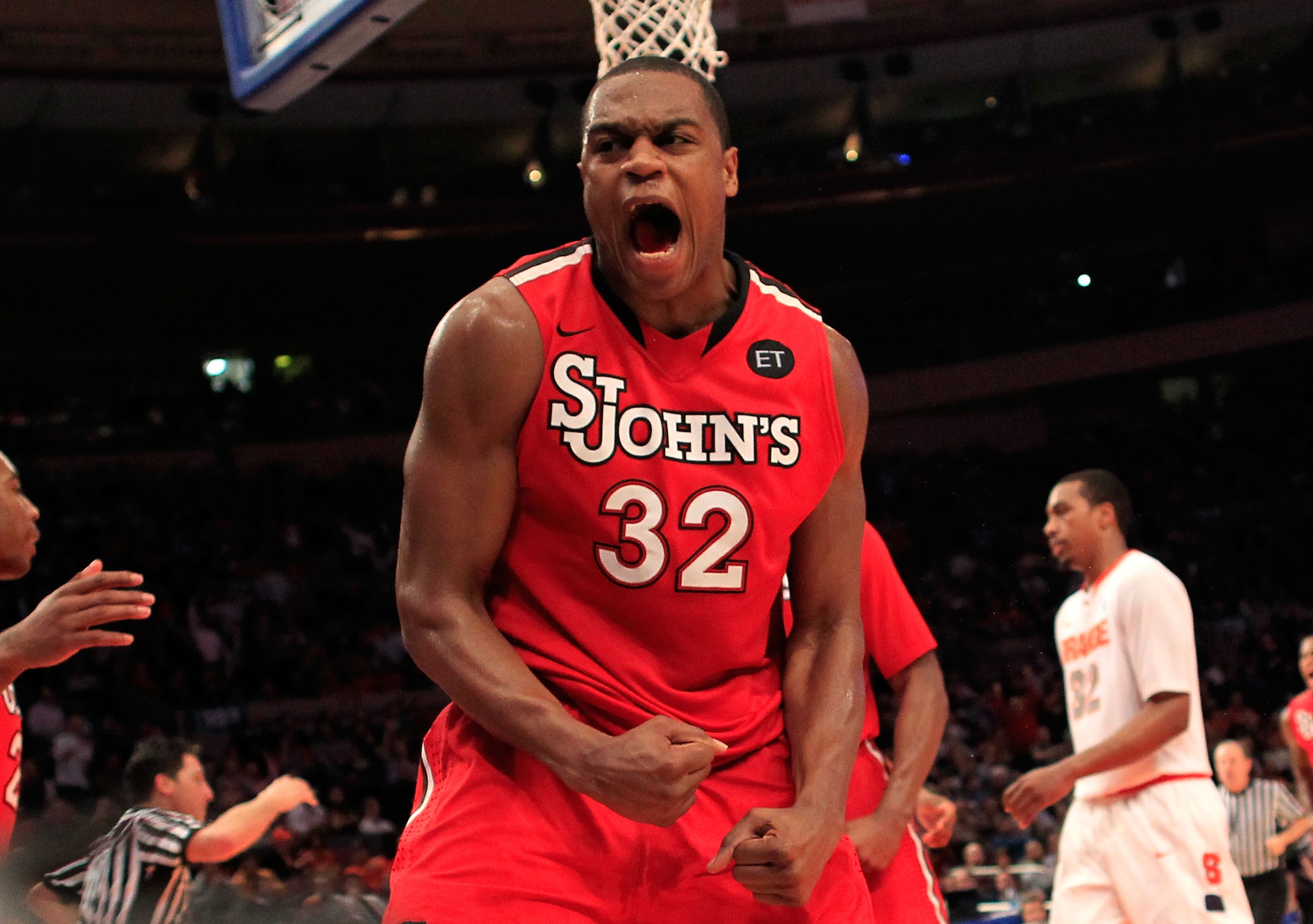 NEW YORK, NY - MARCH 10:  Justin Brownlee #32 of the St. John's Red Storm reacts after a play in the second half against the Syracuse Orange during the quarterfinals of the 2011 Big East Men's Basketball Tournament presented by American Eagle Outfitters