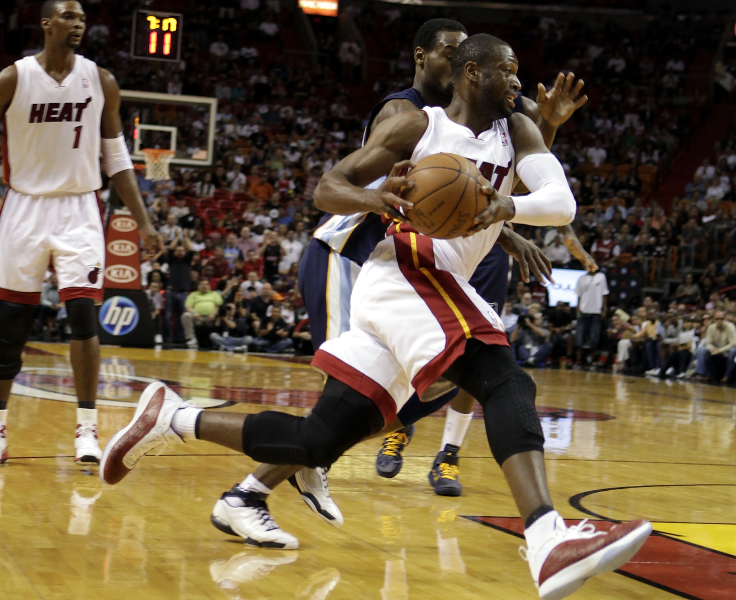 MIAMI - MARCH 12: Guard Dwyane Wade #3 of the Miami Heat drives against the Memphis Grizzlies at American Airlines Arena on March 12, 2011 in Miami, Florida. NOTE TO USER: User expressly acknowledges and agrees that, by downloading and/or using this Phot MIAMI - MARCH 12: Guard Dwyane Wade #3 of the Miami Heat drives against the Memphis Grizzlies at American Airlines Arena on March 12, 2011 in Miami, Florida. NOTE TO USER: User expressly acknowledges and agrees that, by downloading and/or using this Phot