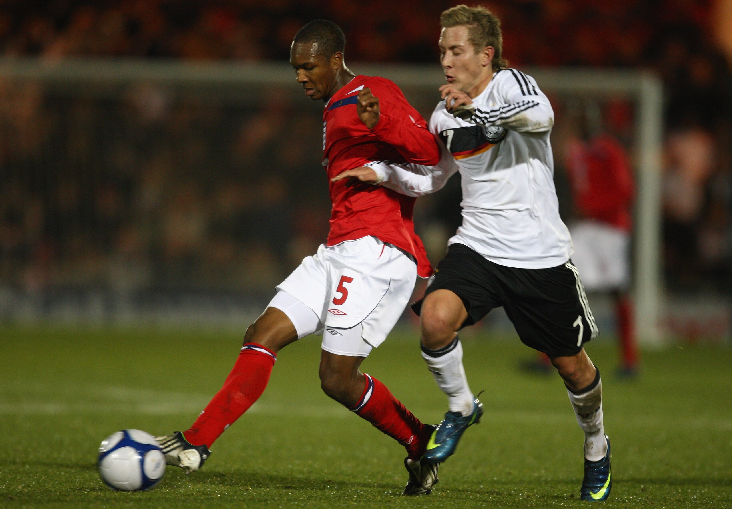 COLCHESTER, UNITED KINGDOM - NOVEMBER 18:  Lewis Holtby of Germany battles with Gavin Hoyte of England during the match between England U19 and Germany U19 at the Weston Homes Community Stadium on November 18, 2008 in Colchester, England.  (Photo by Jamie