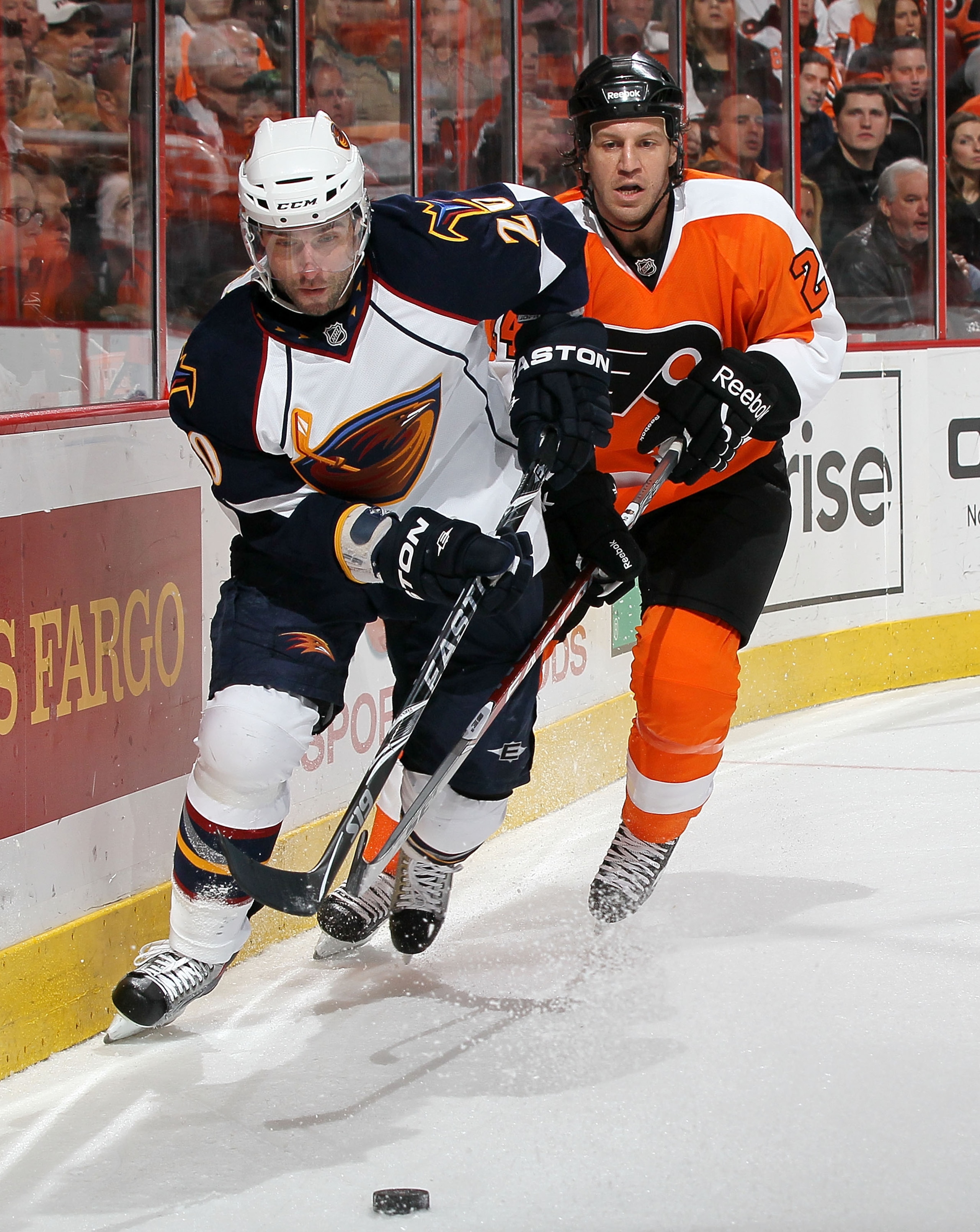 PHILADELPHIA, PA - MARCH 12: Radek Dvorak #20 of the Atlanta Thrashers controls the puck against Nick Boynton #24 of the Philadelphia Flyers on March 12, 2011 at Wells Fargo Center in Philadelphia, Pennsylvania.  (Photo by Jim McIsaac/Getty Images)