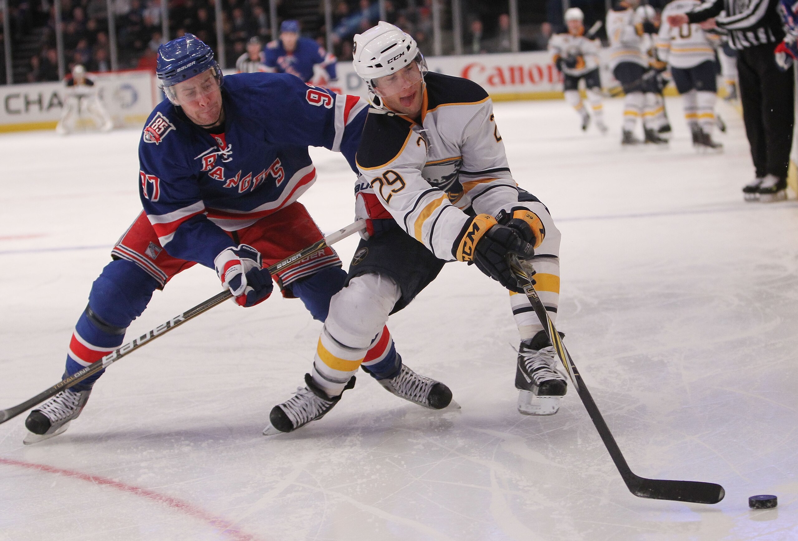 NEW YORK, NY - MARCH 01: Matt Gilroy #97 of the New York Rangers puts pressure on Jason Pominville #29 of the Buffalo Sabres at Madison Square Garden on March 1, 2011 in New York City.  (Photo by Nick Laham/Getty Images)