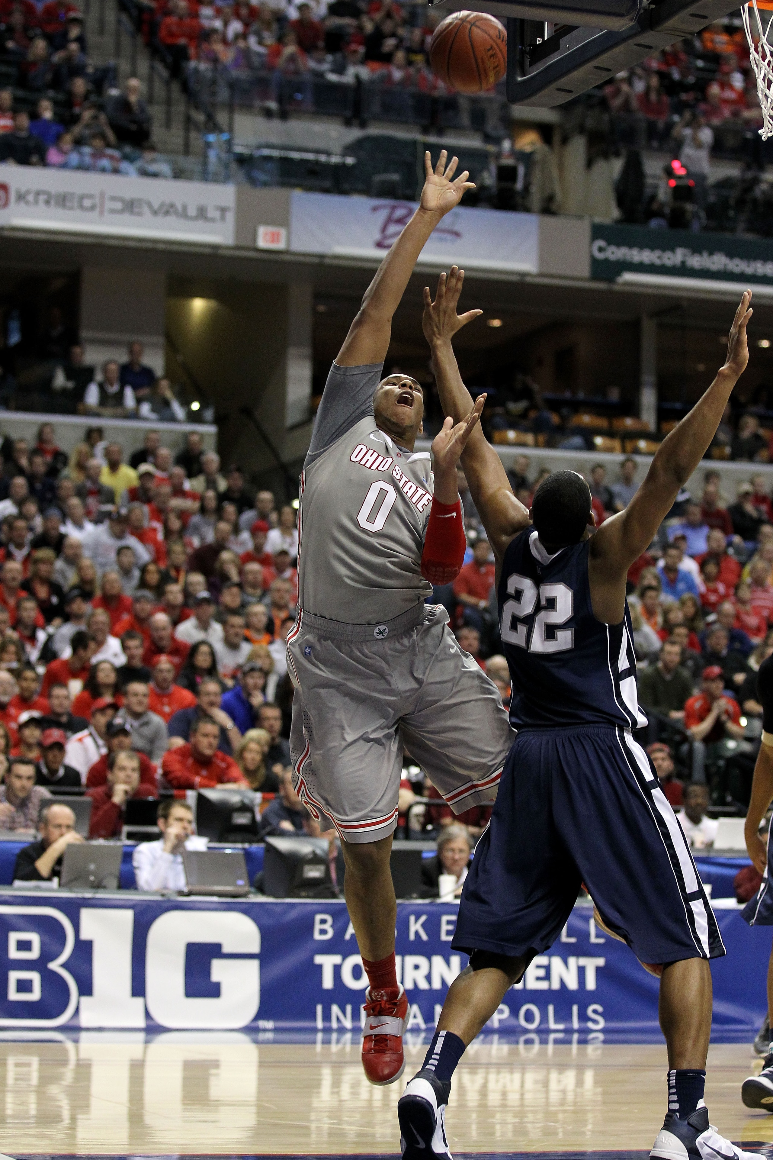 INDIANAPOLIS, IN - MARCH 13:  Jared Sullinger #0 of the Ohio State Buckeyes goes up for a shot attempt against the Andrew Jones #22 of the Penn State Nittany Lions during the championship game of the 2011 Big Ten Men's Basketball Tournament at Conseco Fie