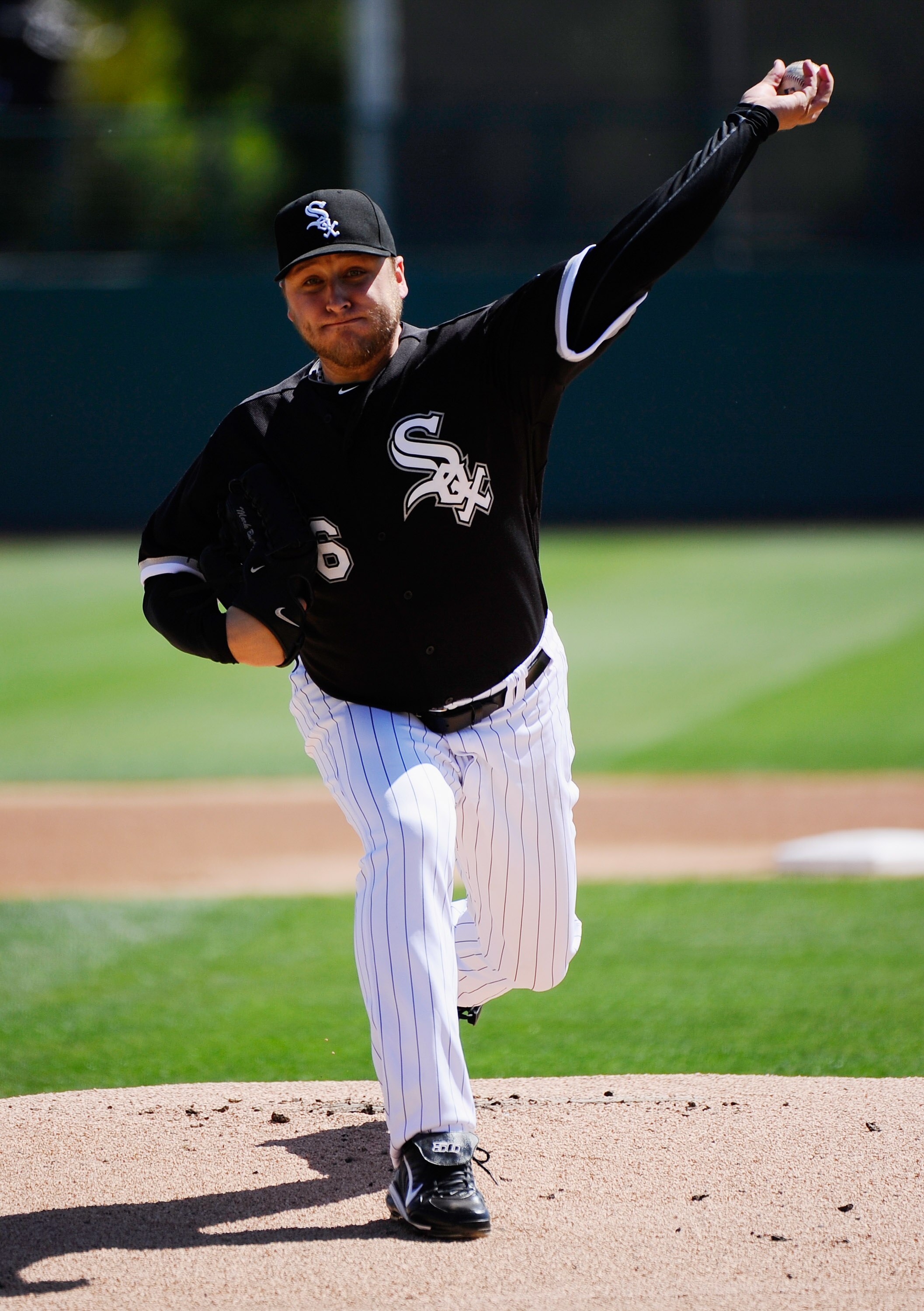 GLENDALE, AZ - MARCH 11:  Pitcher Mark Buehrle #56 of the Chicago White Sox throws a pitch prior to the start of the spring training baseball game against the Chicago Cubs at Camelback Ranch on March 11, 2011 in Glendale, Arizona.  (Photo by Kevork Djanse