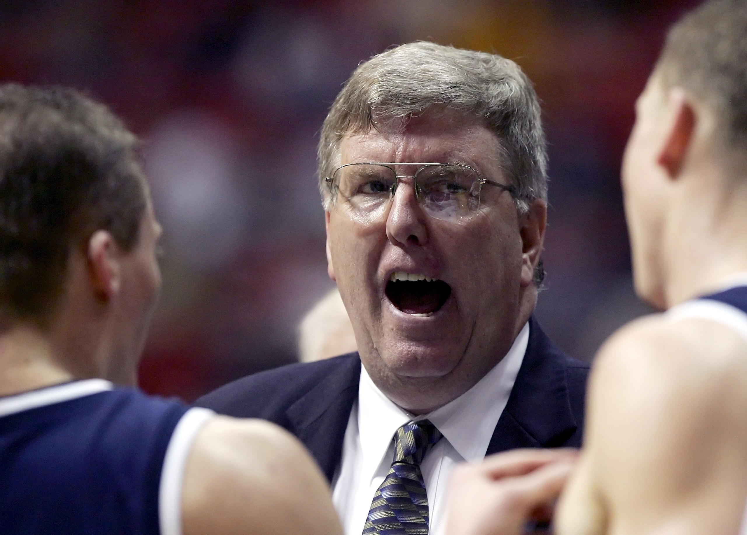 SAN DIEGO - MARCH 16:  Head Coach Stew Morrill of the Utah State Aggies addresses his team during the game against the Washington Huskies at the first round of the NCAA Finals on March 16, 2006 at Cox Arena in San Diego, California.  (Photo by Lisa Blumen