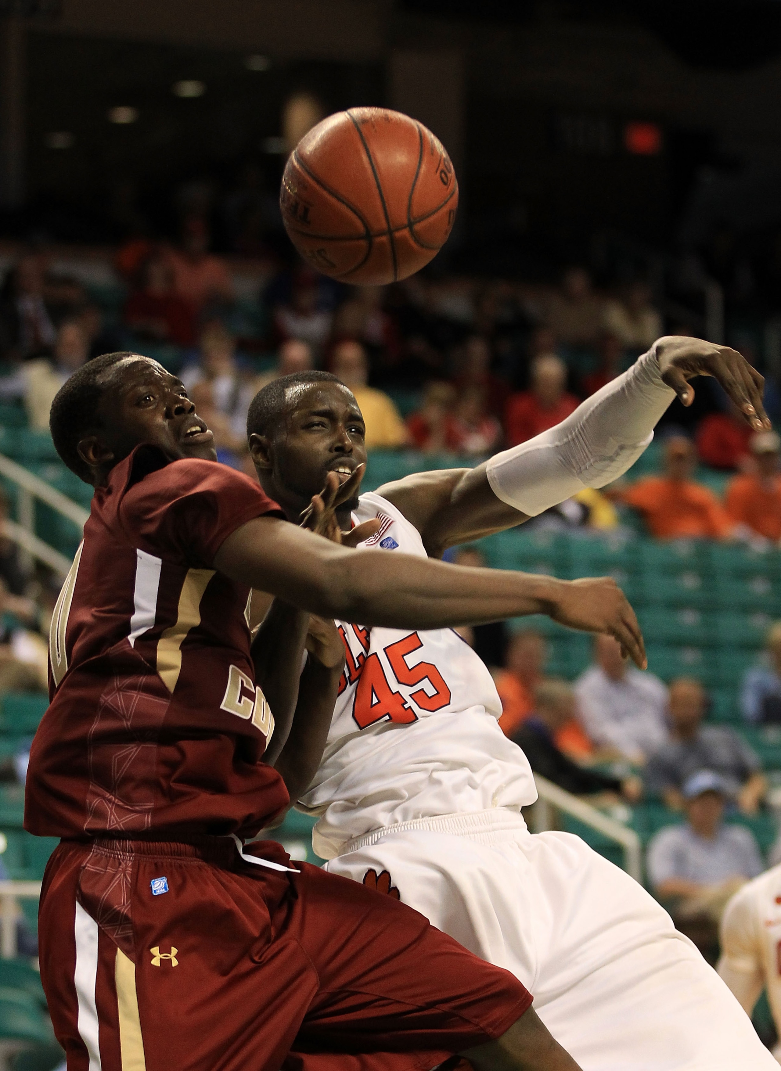 GREENSBORO, NC - MARCH 11:  Jerai Grant #45 of the Clemson Tigers battles for the ball against Reggie Jackson #0 of the Boston College Eagles during the second half in the quarterfinals of the 2011 ACC men's basketball tournament at the Greensboro Coliseu