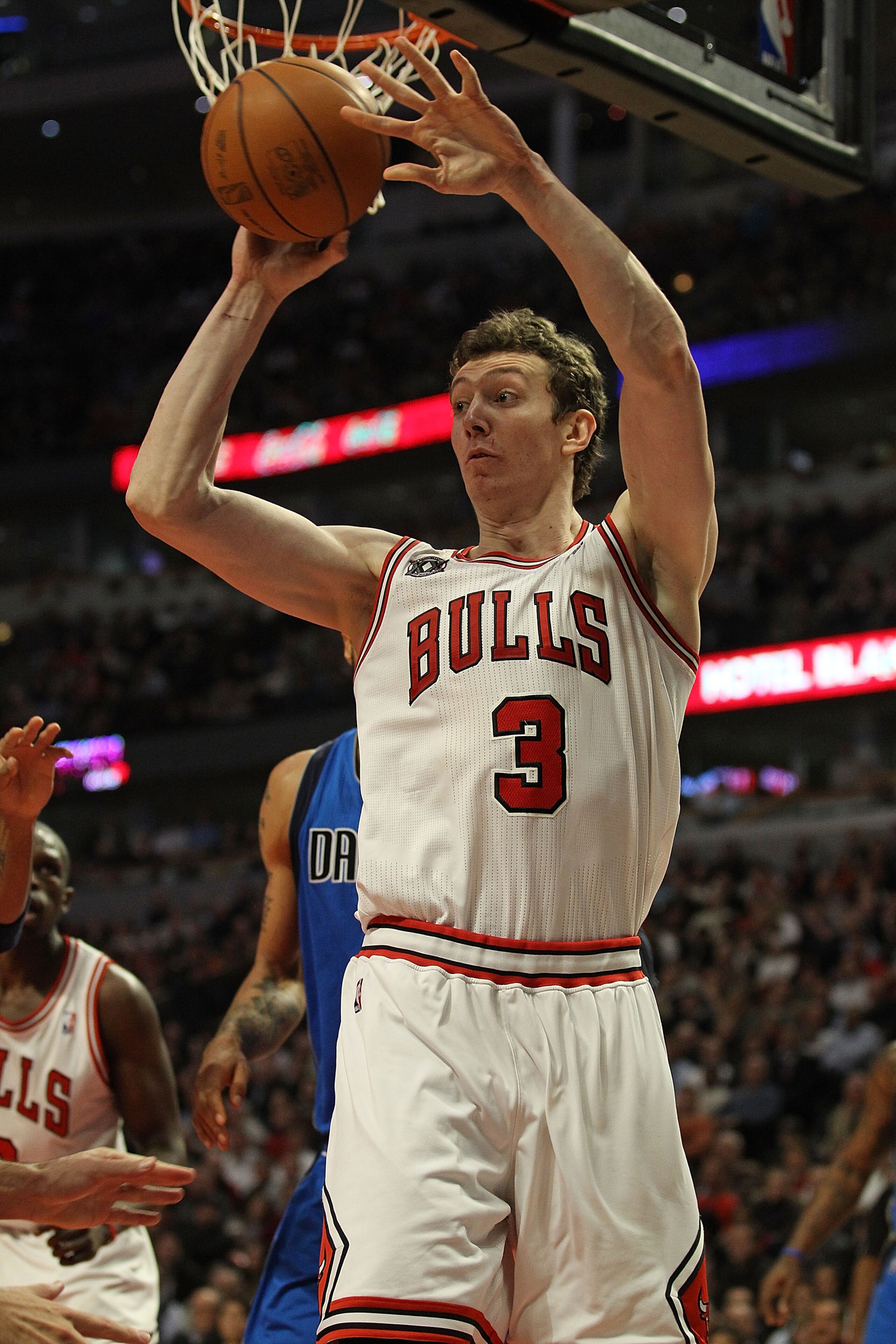 CHICAGO, IL - JANUARY 20: Omer Asik #3 of the Chicago Bulls passes the ball against the Dallas Mavericks at the United Center on January 20, 2011 in Chicago, Illinois. The Bulls defeated the Mavericks 82-77. NOTE TO USER: User expressly acknowledges and a