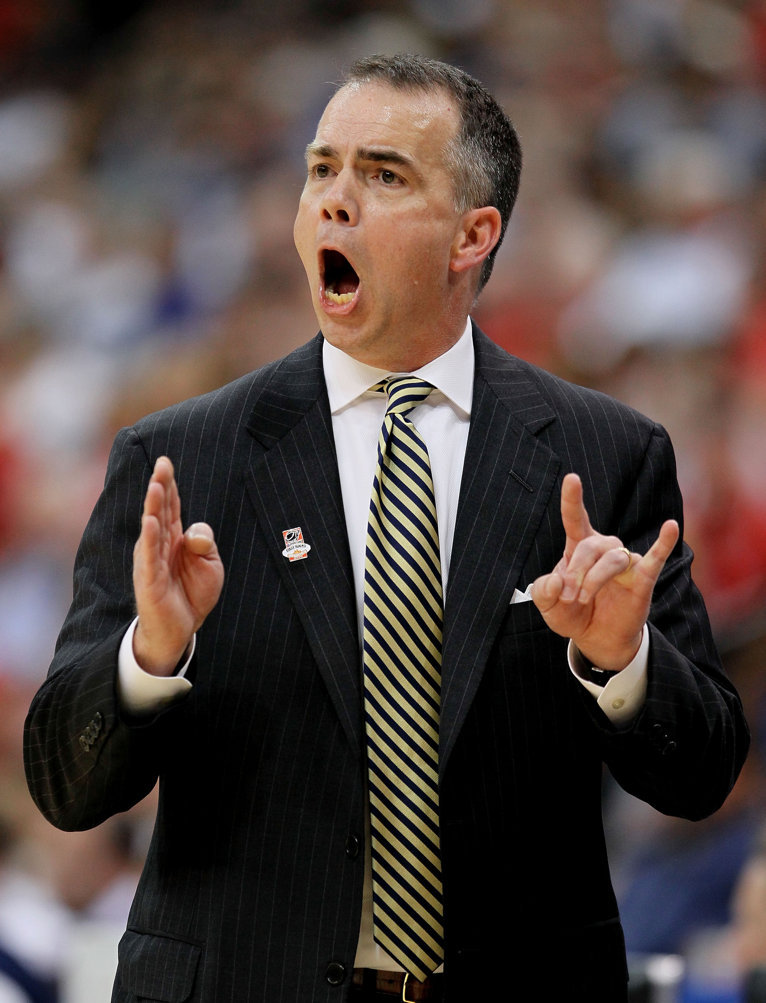 JACKSONVILLE, FL - MARCH 19:  Mike Young head coach of the Wofford Terriers instructs his team against the Wisconsin Badgers during the first round of the 2010 NCAA men's basketball tournament at Jacksonville Veteran's Memorial Arena on March 19, 2010 in