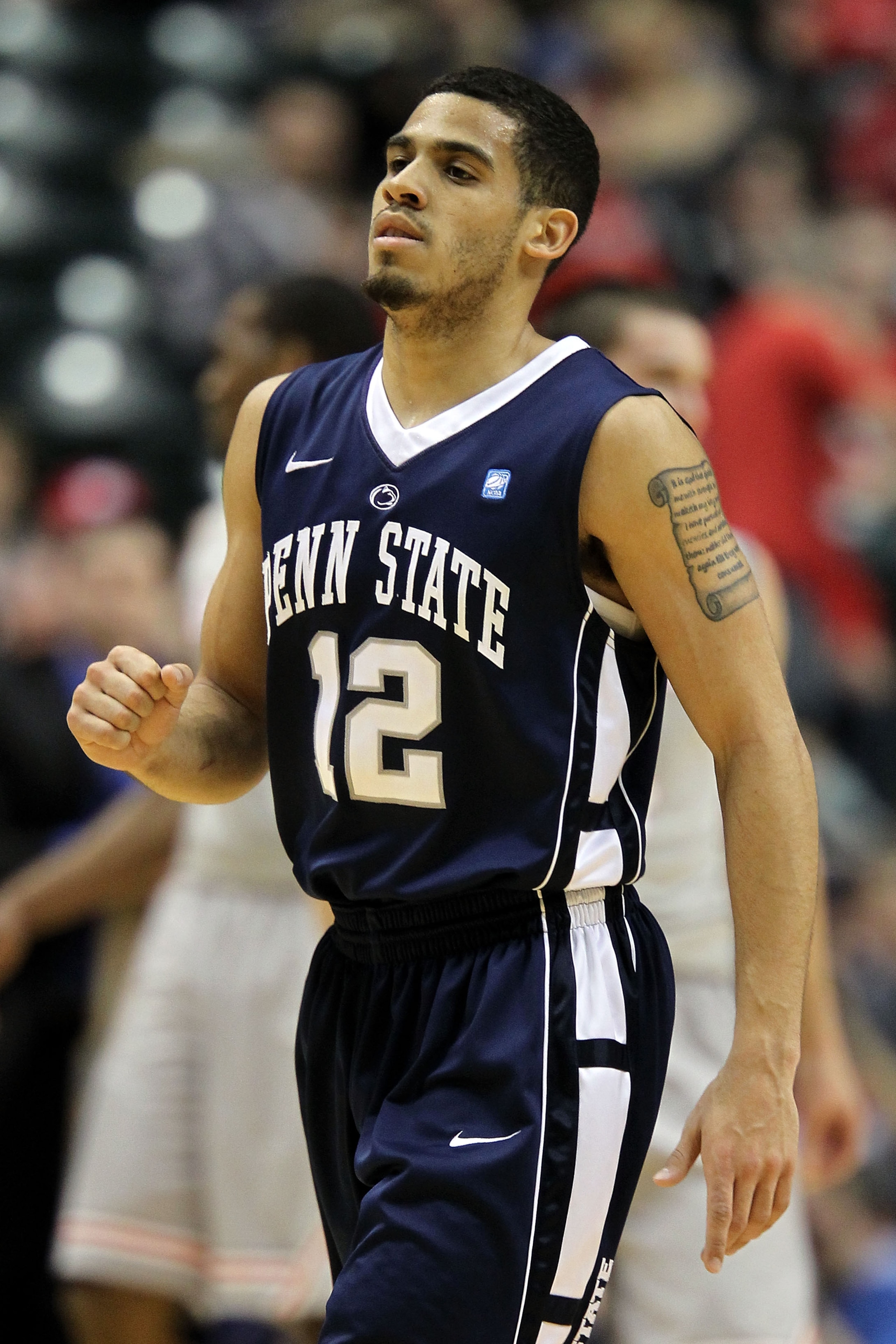 INDIANAPOLIS, IN - MARCH 13:  Talor Battle #12 of the Penn State Nittany Lions reacts against the Ohio State Buckeyes during the championship game of the 2011 Big Ten Men's Basketball Tournament at Conseco Fieldhouse on March 13, 2011 in Indianapolis, Ind