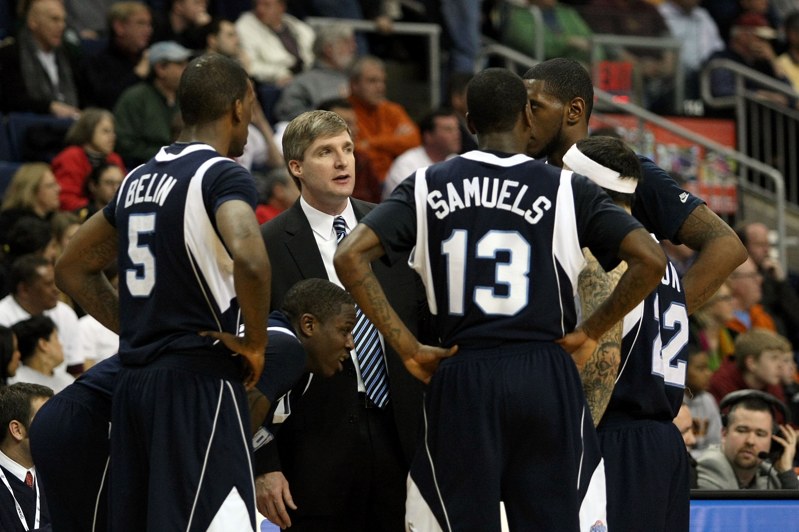 BRIDGEPORT, CT - MARCH 07:  Head coach John Dunne of the St. Peter's Peacocks talks with his players during a timeout against the Iona Gaels during the final of the MAAC men's conference basketball tournment at Webster Bank Arena at Harbor Yard on March 7
