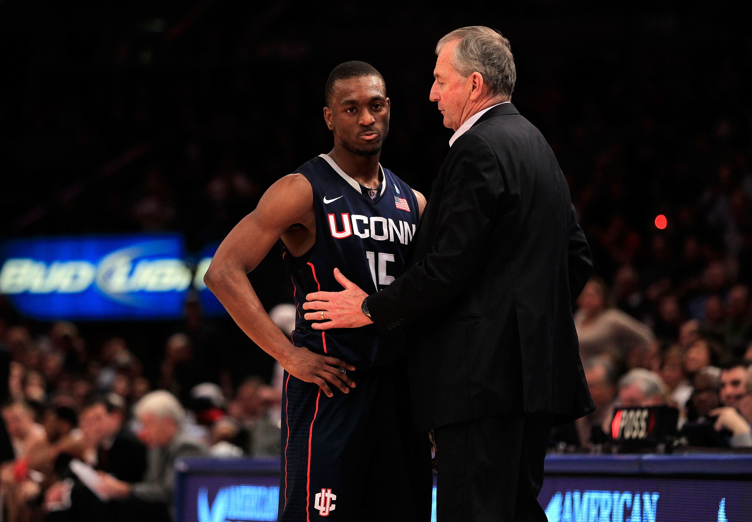 NEW YORK, NY - MARCH 12: Kemba Walker #15 of the Connecticut Huskies speaks with head coach Jim Calhoun during the championship of the 2011 Big East Men's Basketball Tournament presented by American Eagle Outfitters at Madison Square Garden on March 12, 2