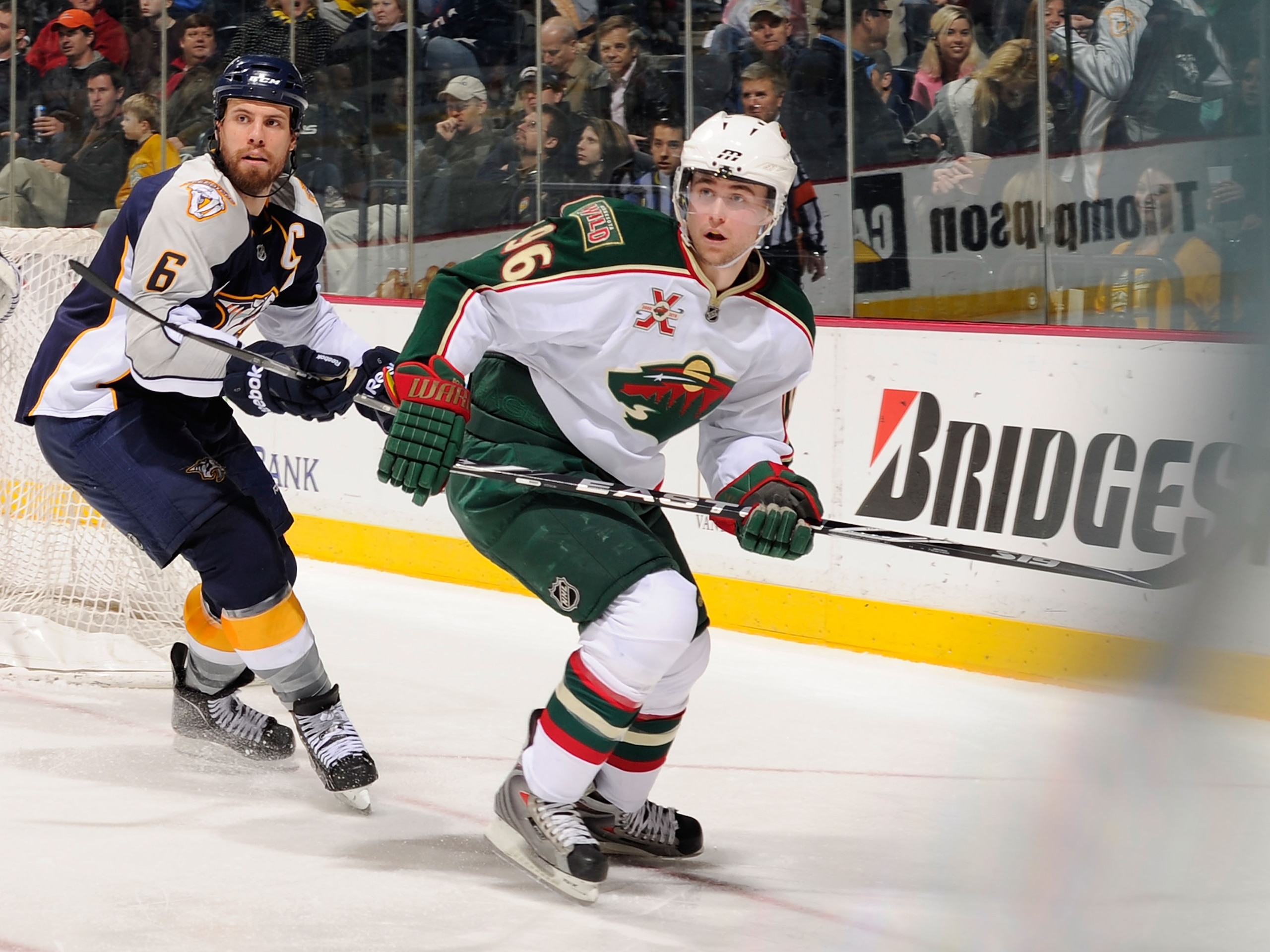 NASHVILLE, TN - MARCH 10:   Pierre-Marc Bouchard #96 of the Minnesota Wild skates against Shea Weber #6 of the Nashville Predators on March 10, 2011 at the Bridgestone Arena in Nashville, Tennessee.  (Photo by Frederick Breedon/Getty Images)