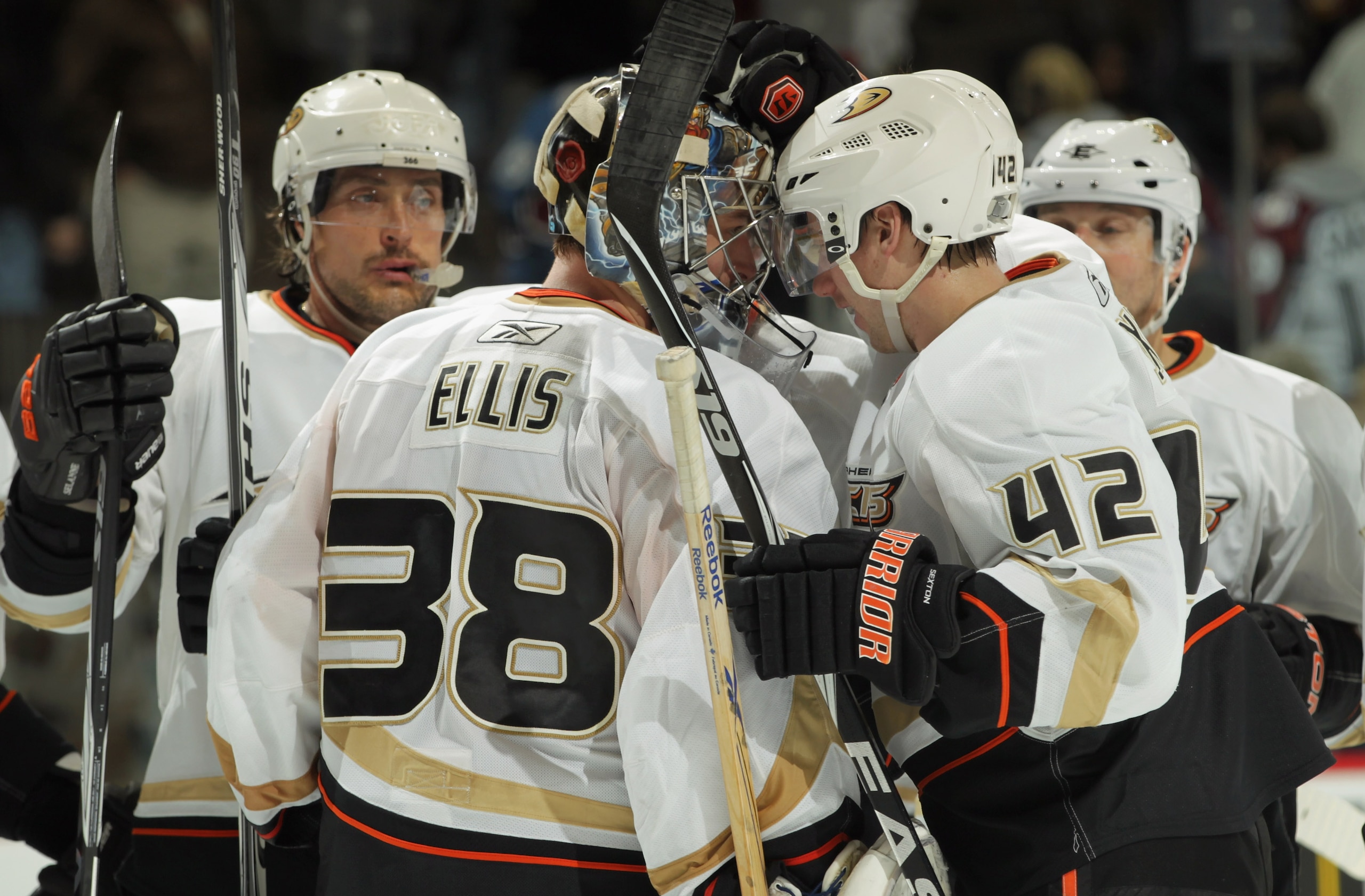 DENVER, CO - MARCH 11:  Goalie Dan Ellis #38 of the Anaheim Ducks celebrates with teammates Teemu Selanne #8 and Dan Sexton #42 after their victory over the Colorado Avalanche during NHL action at the Pepsi Center on March 11, 2011 in Denver, Colorado. El