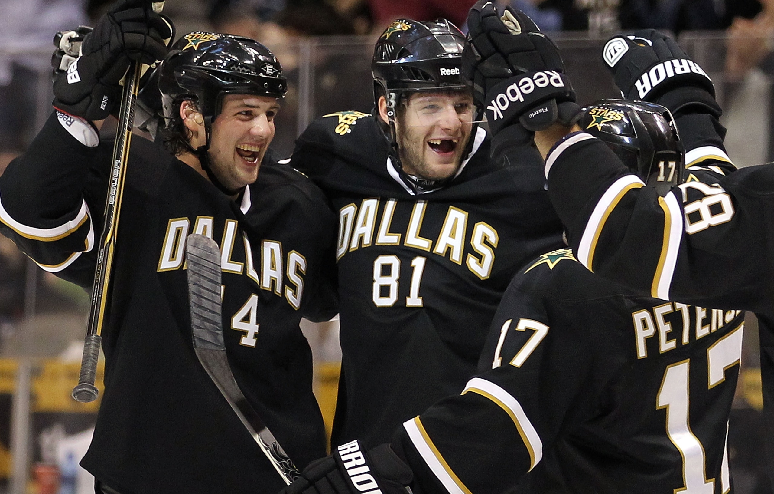 DALLAS, TX - MARCH 09:  Center Tomas Vincour #81 of the Dallas Stars celebrates his first NHL goal with Jamie Benn #14 and Toby Petersen #17 against the Calgary Flames at American Airlines Center on March 9, 2011 in Dallas, Texas.  (Photo by Ronald Martin